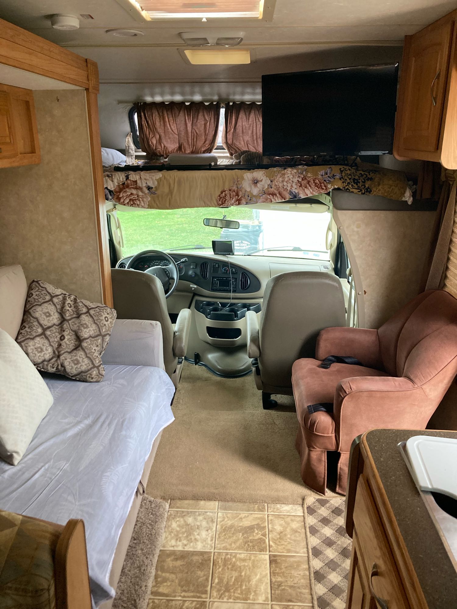 Explore this RV rental's interior: comfy living space,. Coachmen Freelander 2009