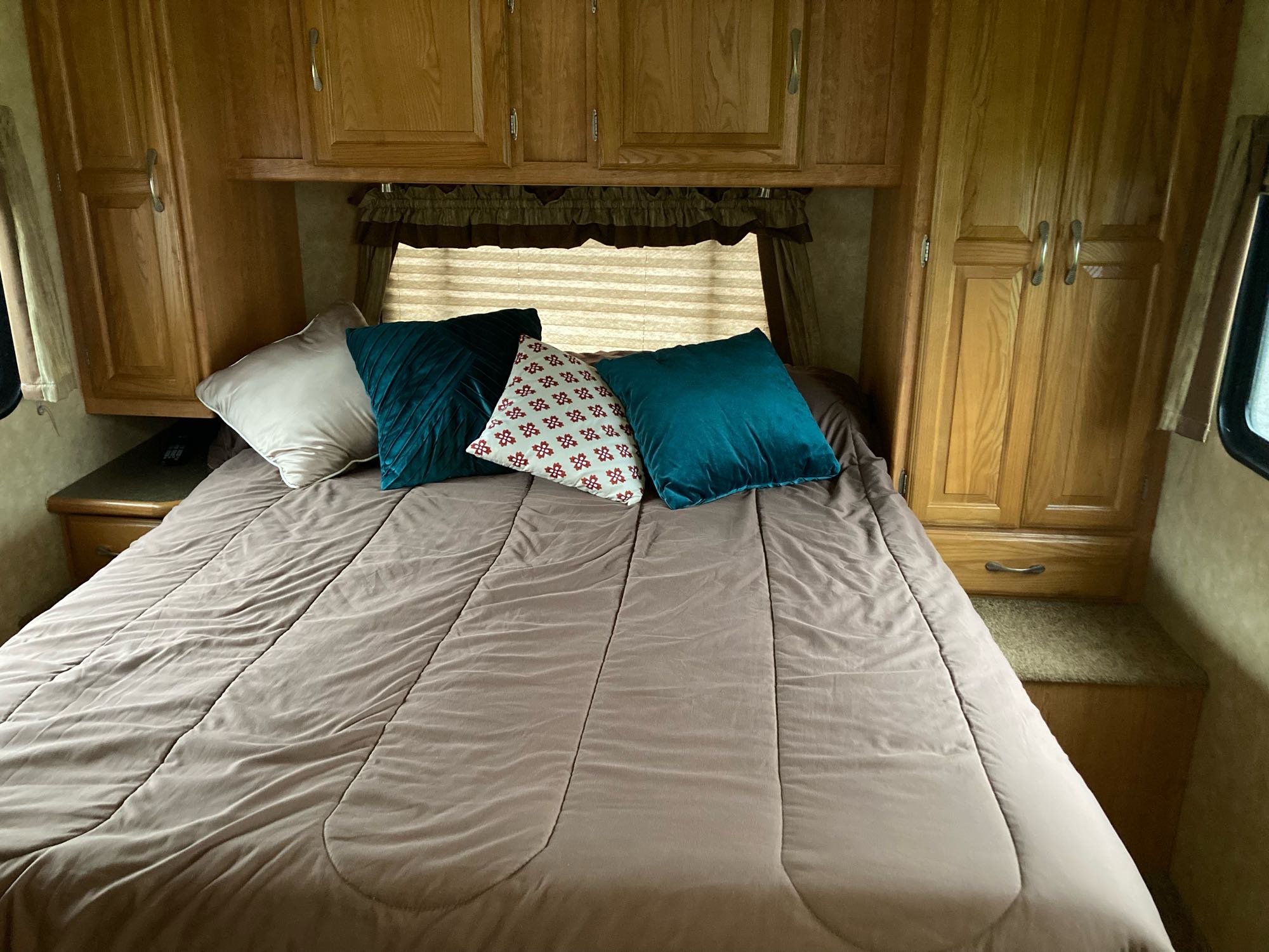 Cozy rv rental bedroom with a comfy bed. Coachmen Freelander 2009
