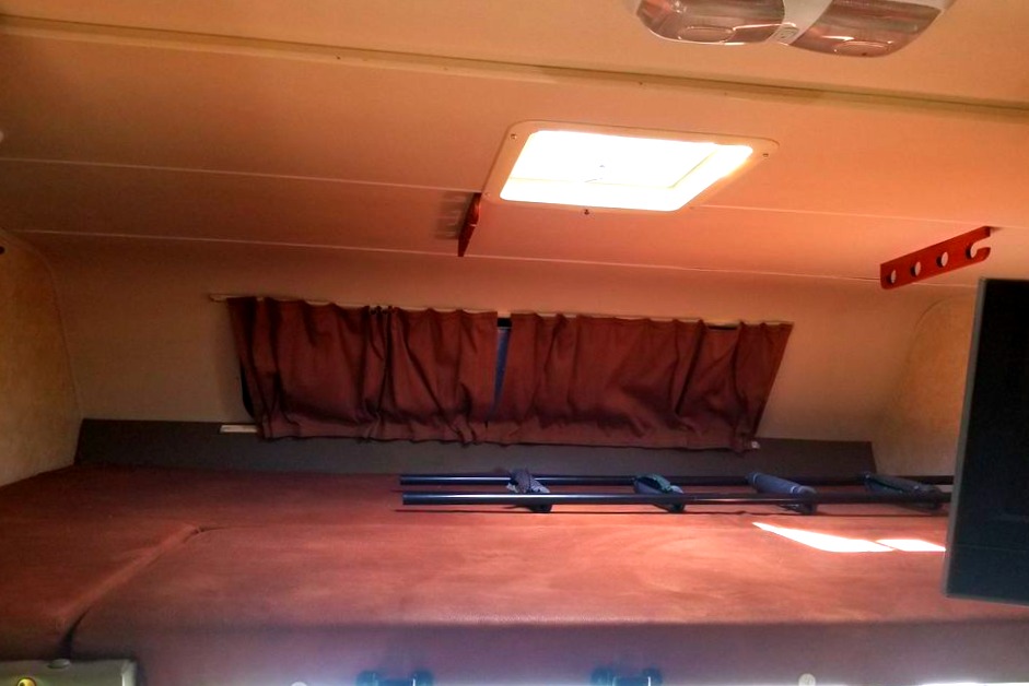 57x95 (roughly queen size). The 32 inch tv swings back to viewing position in the bunk a well.. Forest River Coachmen Freelander 2012