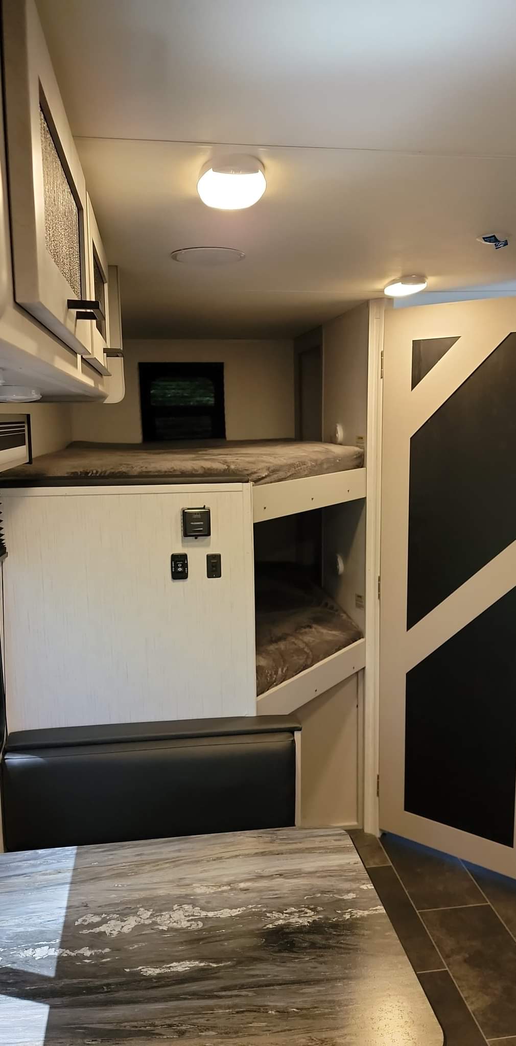 Cozy RV rental interior: bunk beds, dining area, and compact design for comfortable travel.. Heartland Mallard 2022