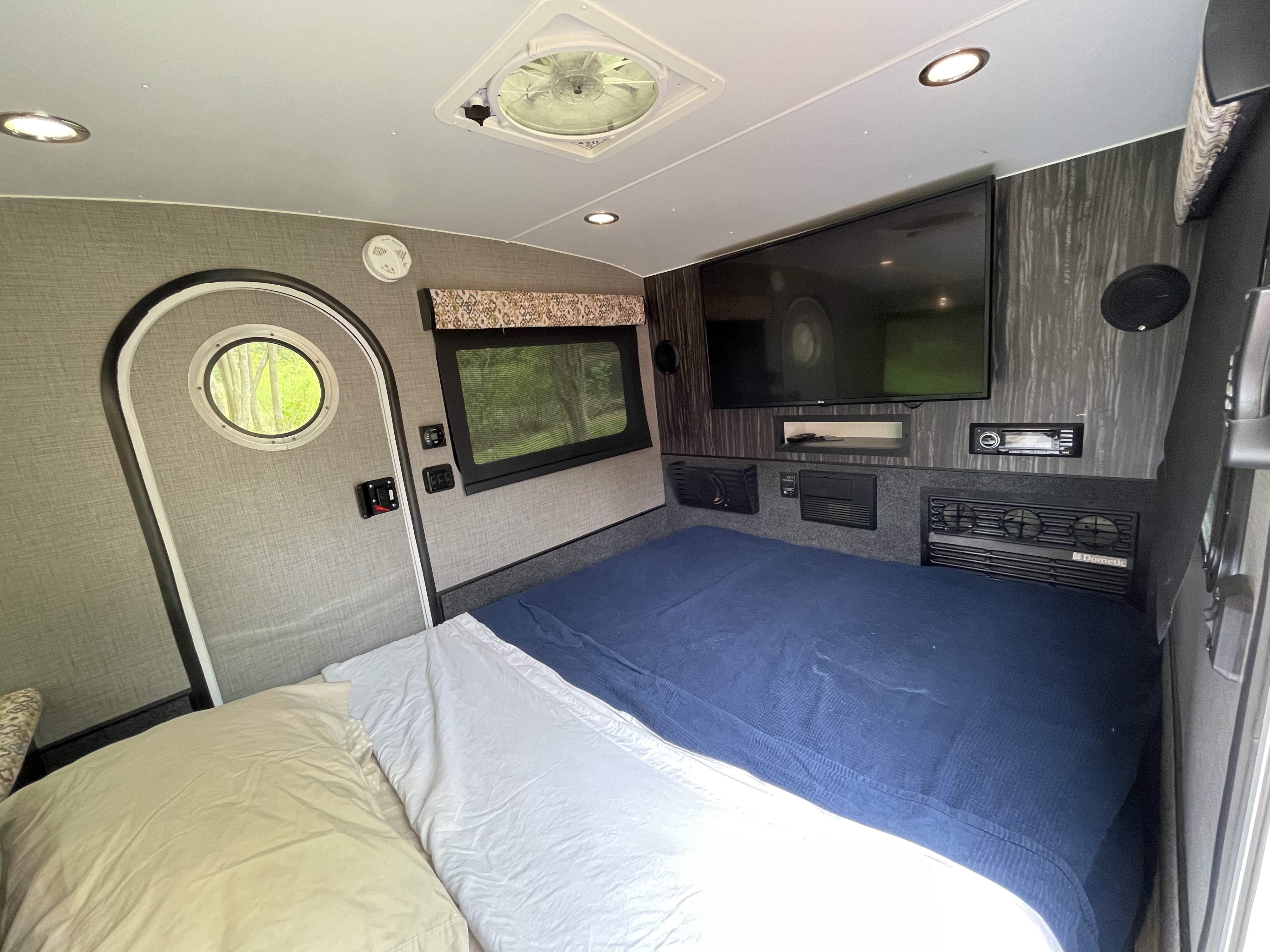 RV rental: Compact, comfortable interior with a bed, TV, and essentials for your next adventure.. InTech RV InTech RV Trailer 2018