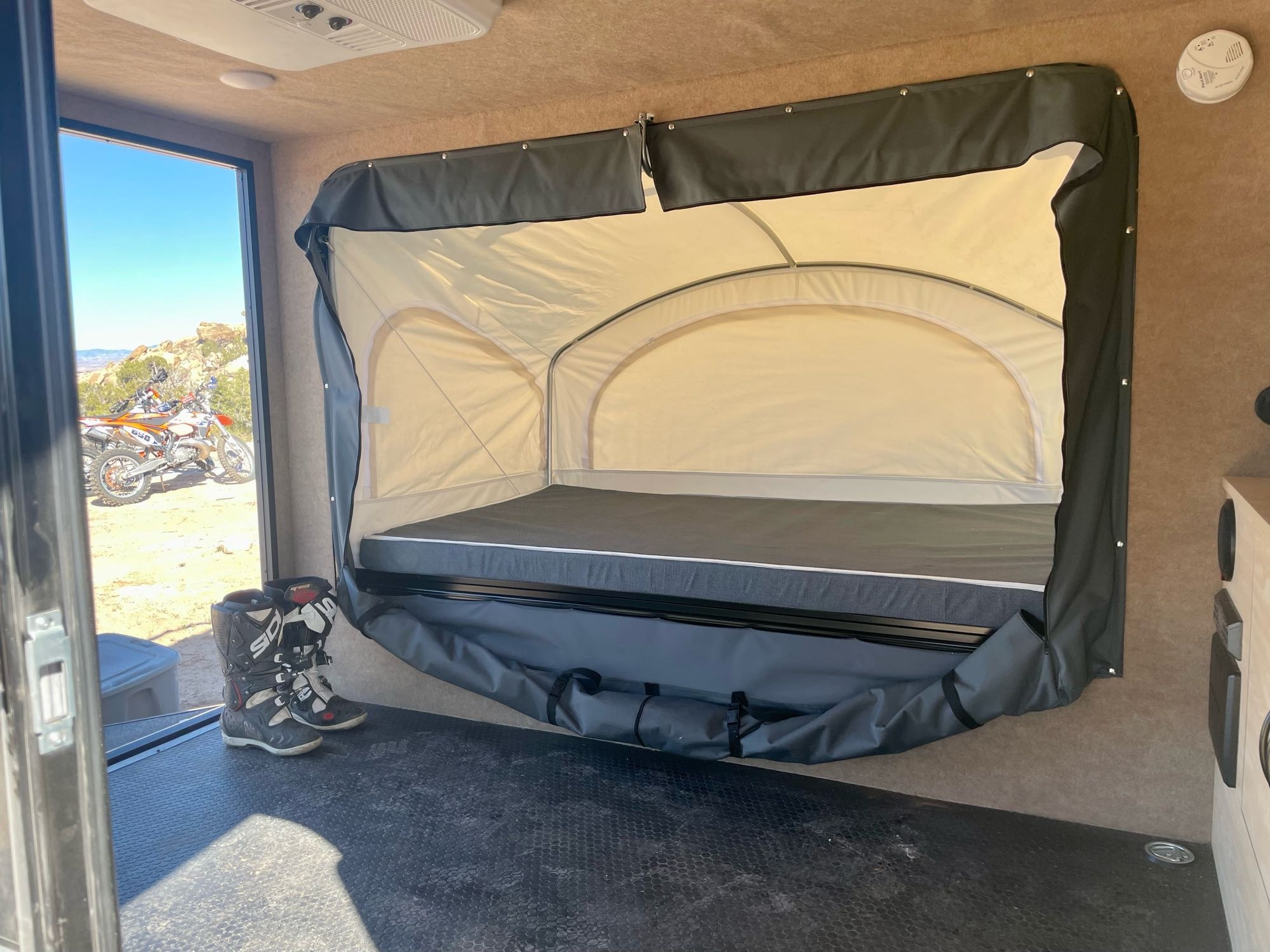 Comfortably sleeps two on the tip-out bed with room on the floor for additional sleepers.. Intech Explorer 2019