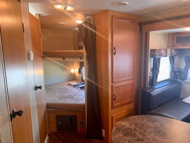 RV rental: Interior view with bunk beds, main bed, dinette, & storage. Comfort & convenience for travel.. KZ Spree Connect 2015