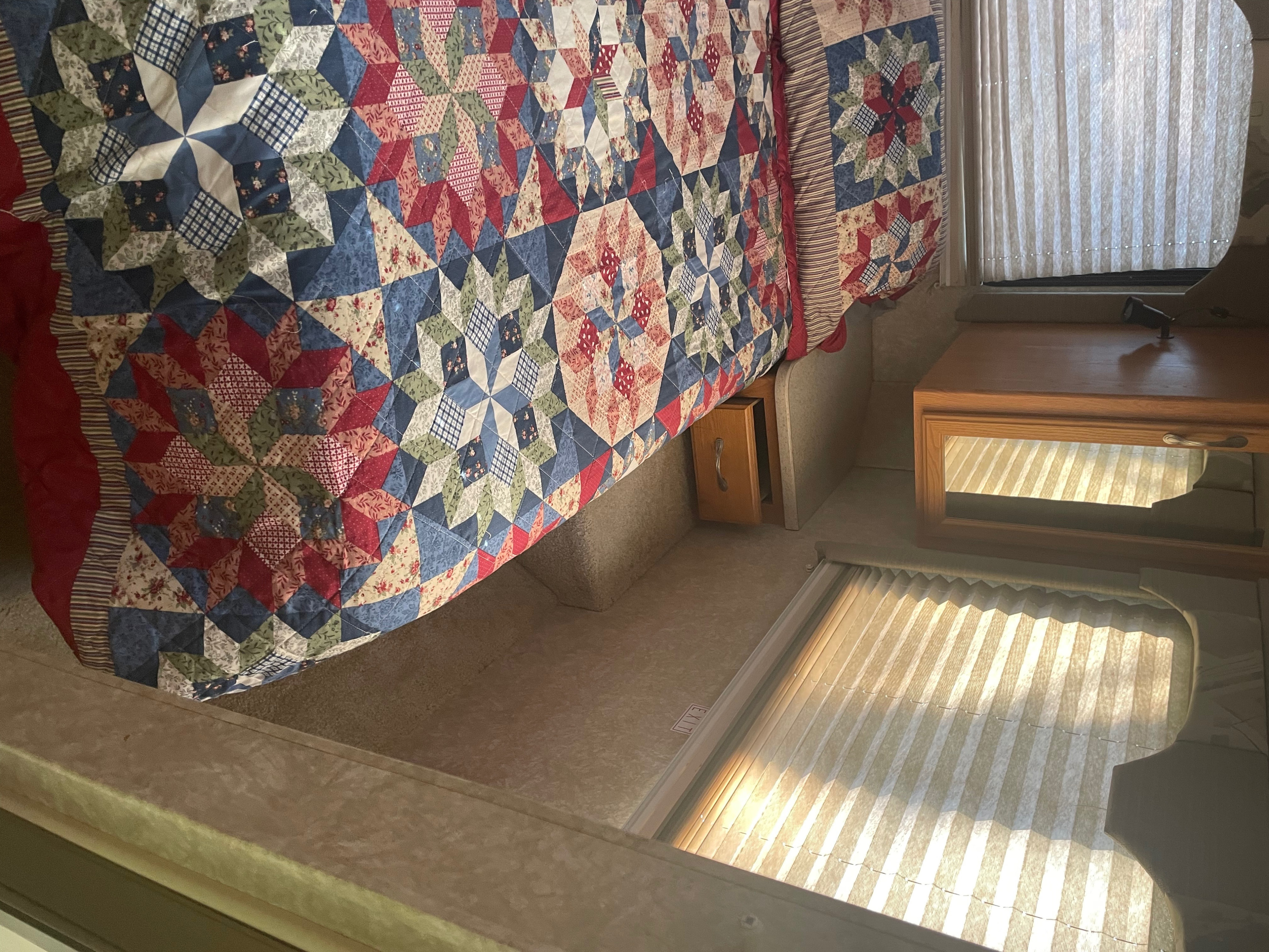Cozy RV rental bedroom with a colorful. Four Winds 5000 2007
