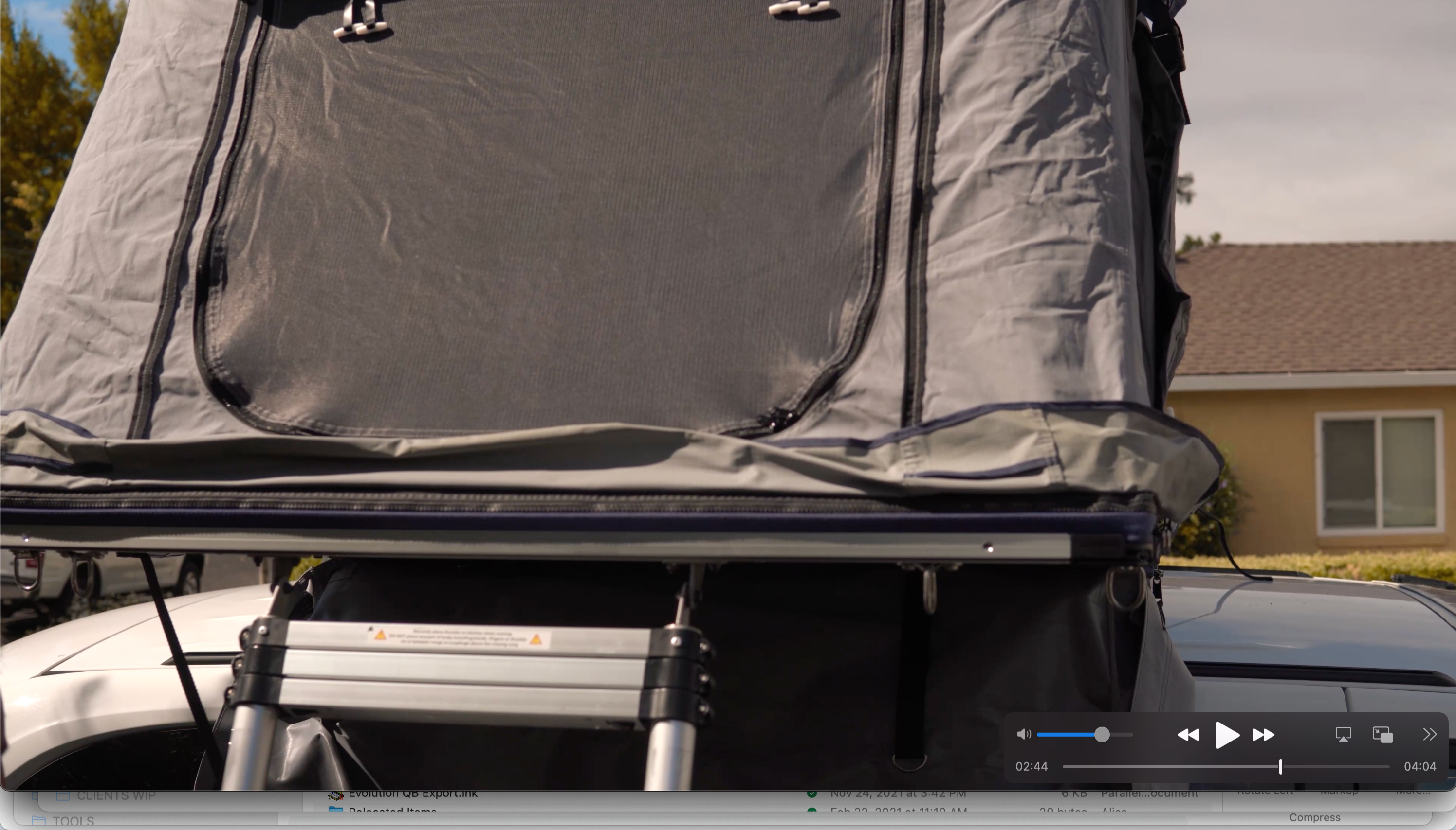 Rooftop tent deployed on a vehicle, offering a compact camping experience, an alternative to traditional RV rental.. Dodge Grand Caravan 2019