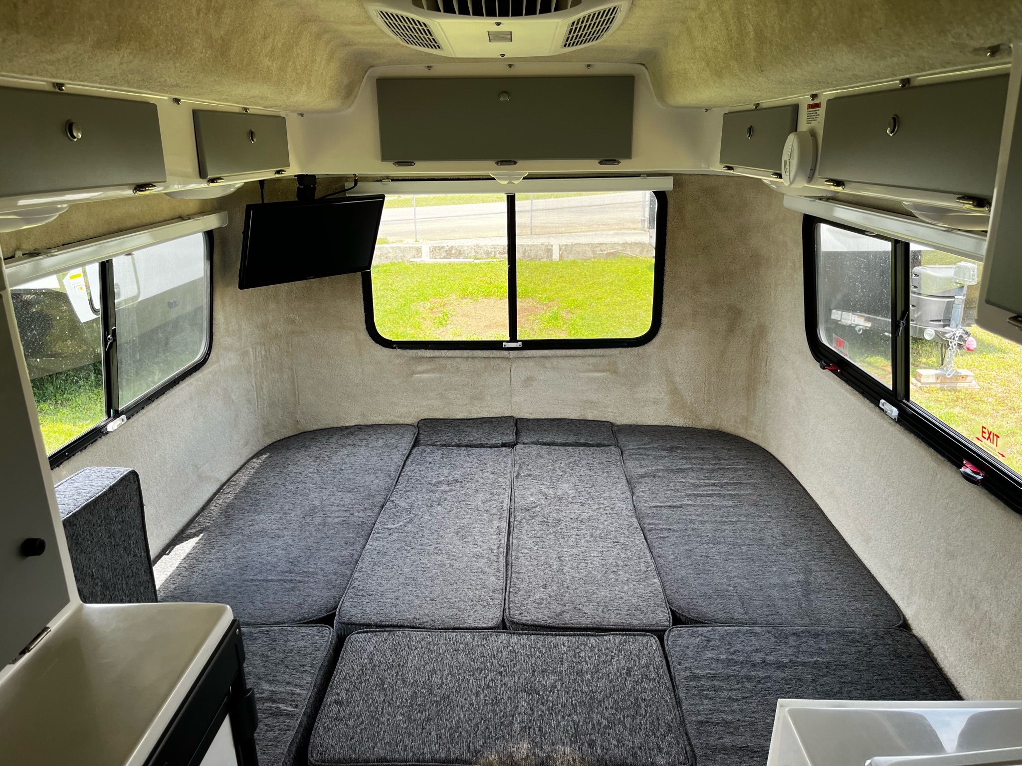 Inside a cozy RV rental: a large, convertible bed and ample storage for comfortable adventures.. Casita Liberty 2021