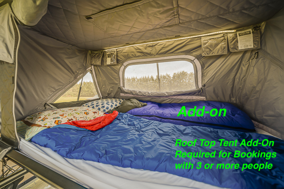 Rooftop tent add-on for RV rentals: a spacious sleeping area with bedding, windows, and internal lighting.. Bean Trailer Bean Stock 2022
