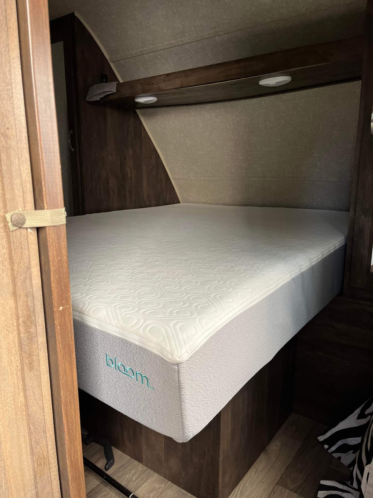 This RV rental features a comfortable new Bloom mattress in its compact bedroom area.. Forest River Vibe Extreme Lite 2019