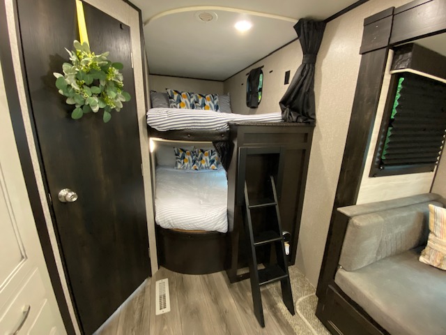 Inside this rv rental: two bunk beds with ladder, plus a comfortable sofa. Perfect for travel.. Jayco Jay Flight 2021