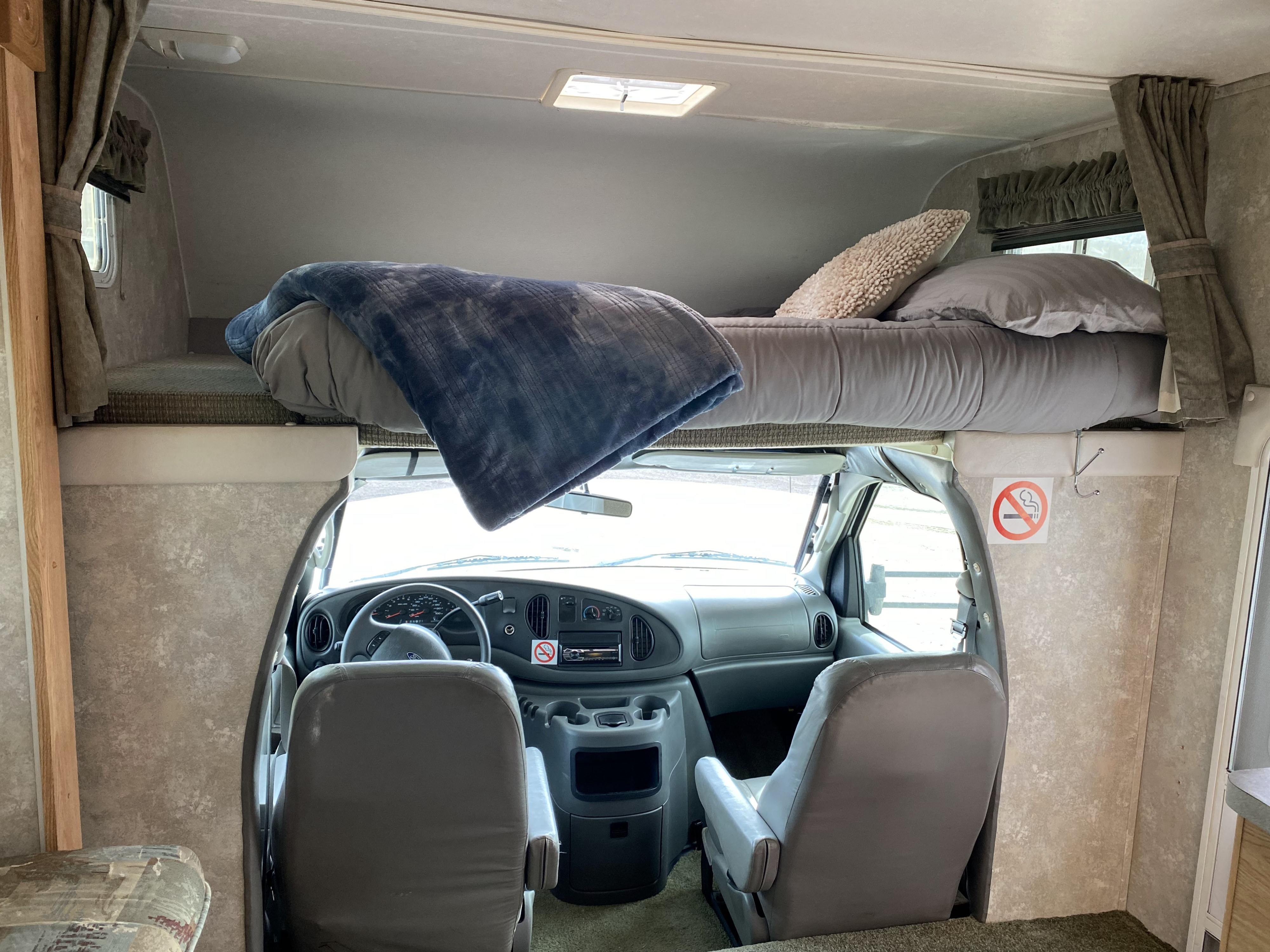 A comfortable king-sized bed is extra roomy.. Coachmen Freedom Express 2005