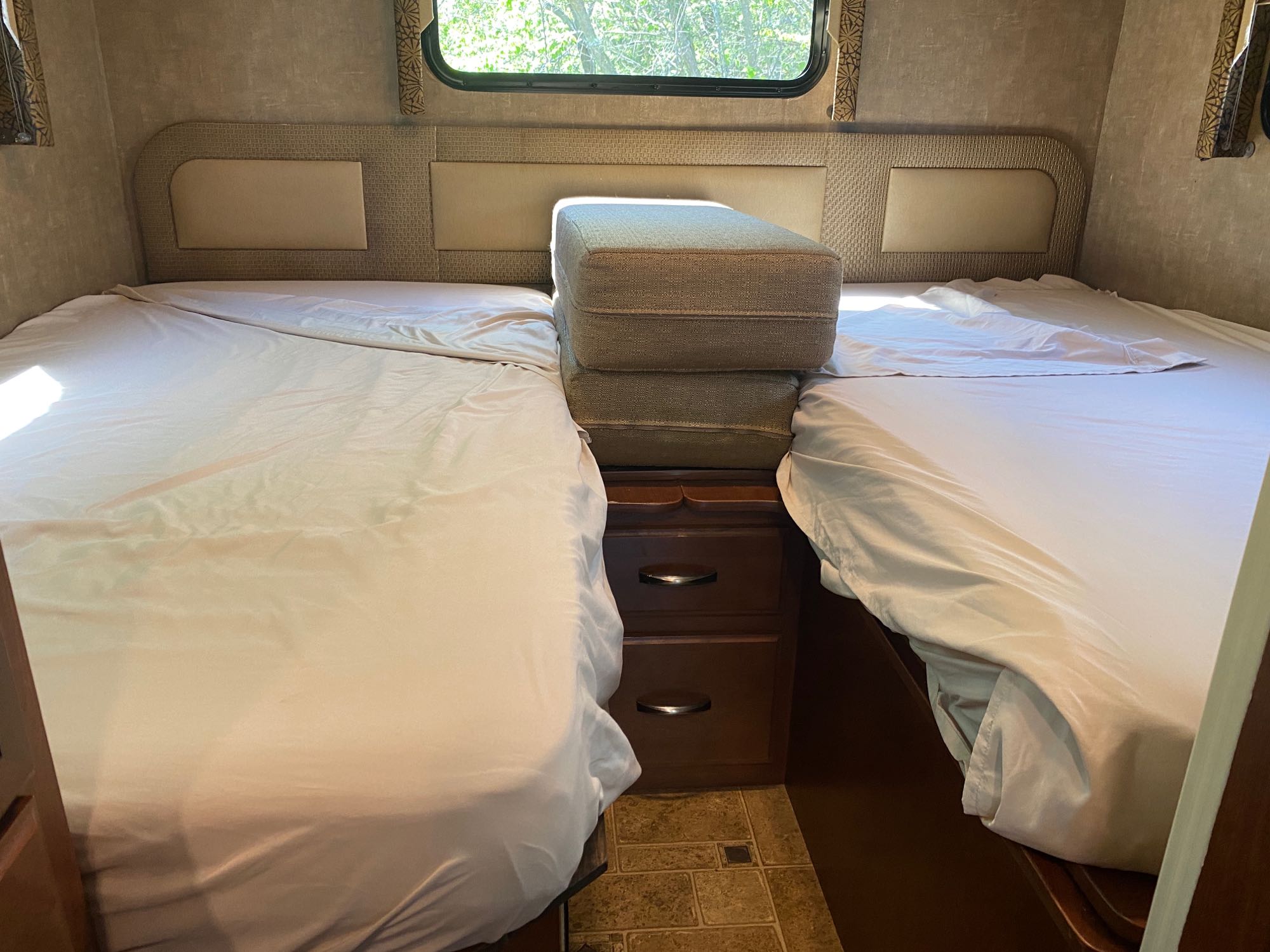 These two beds can remain as a twin or they can slide together and become a large king size bed.. Thor Motor Coach Vegas 2015