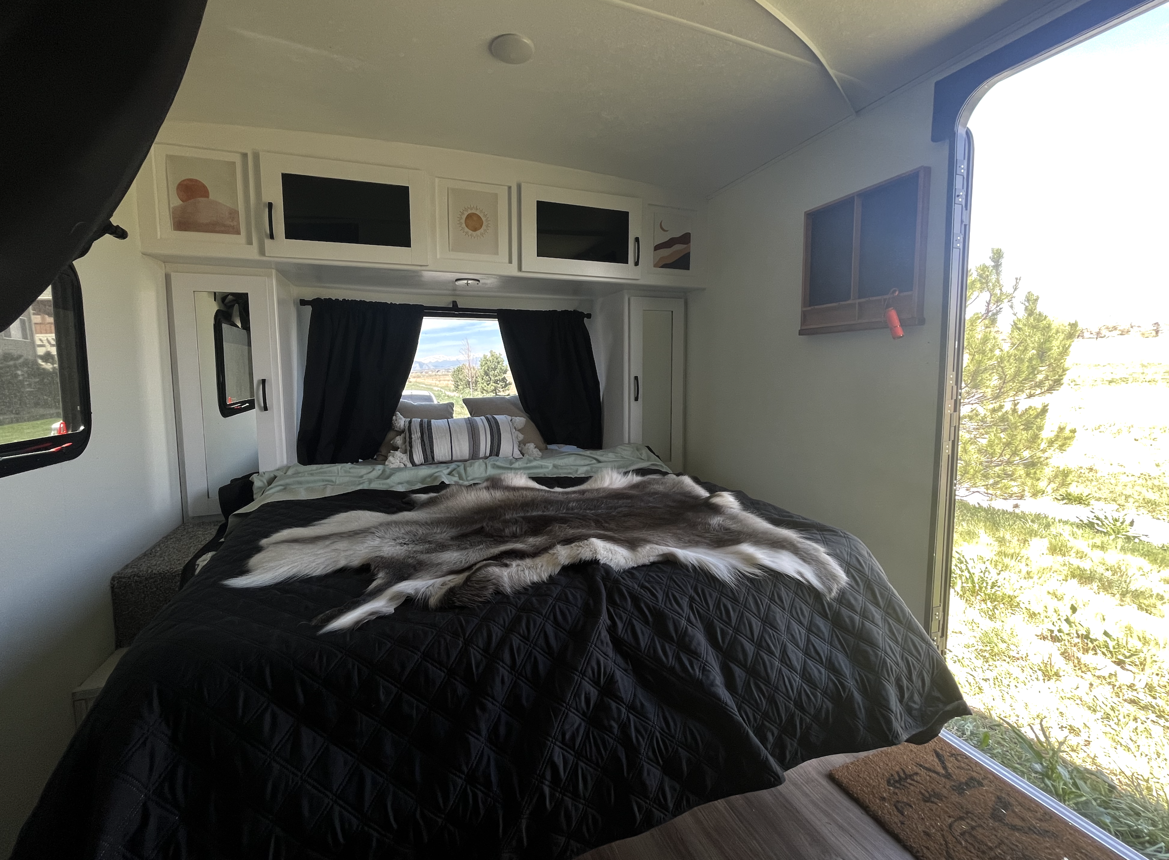 Queen bed after folder the couch down.. Forest River Coachmen Apex Nano Off-Grid 2022