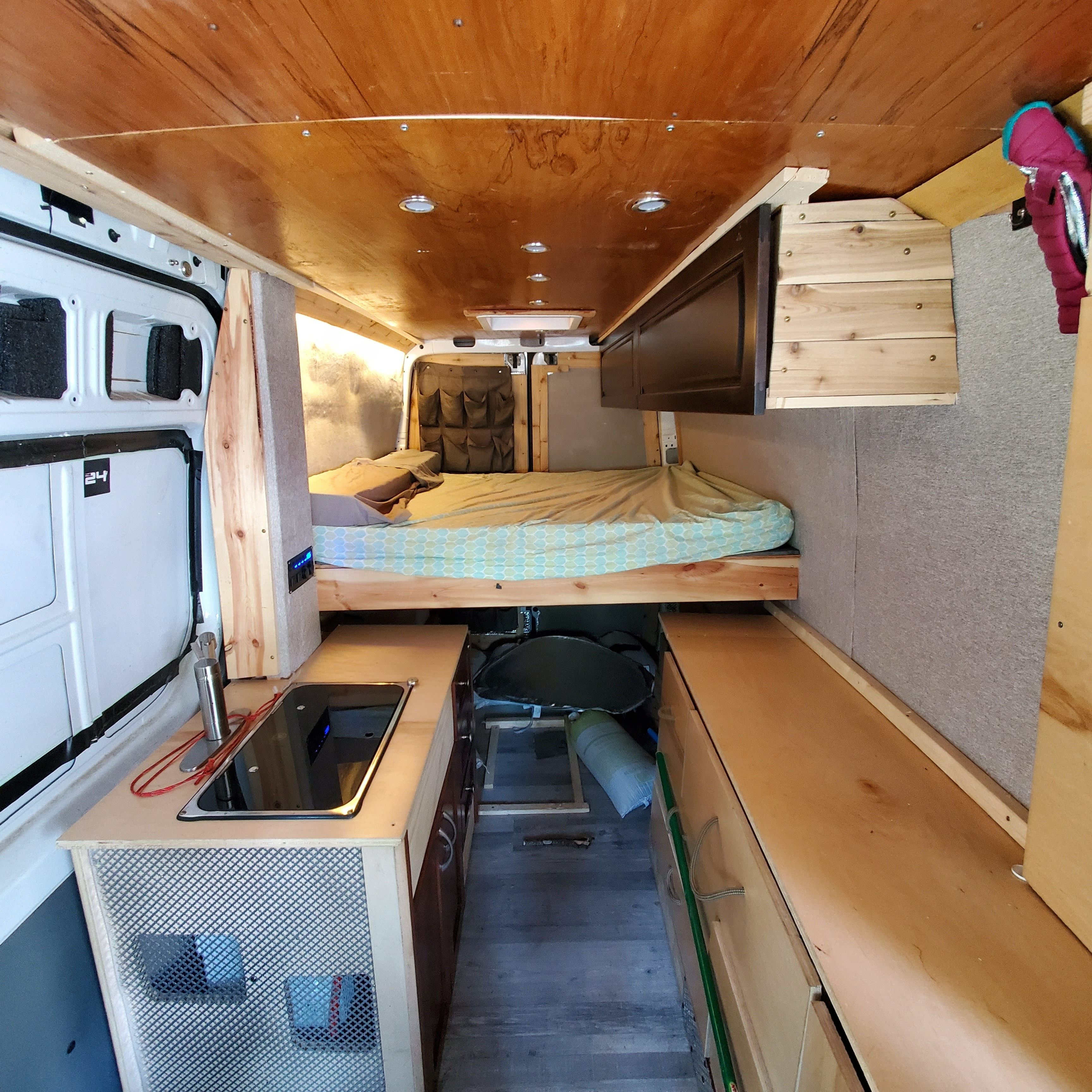 This RV rental shows a full van conversion: bed, kitchen area, storage, and wooden ceiling. Ideal for travel.. Mercedes-Benz B class campervan MB 140 2011