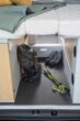 Spacious under-bed storage in this RV rental campervan holds adventure gear like a backpack and ropes.. NOMAD COMPACT FONT VENDOME 2023