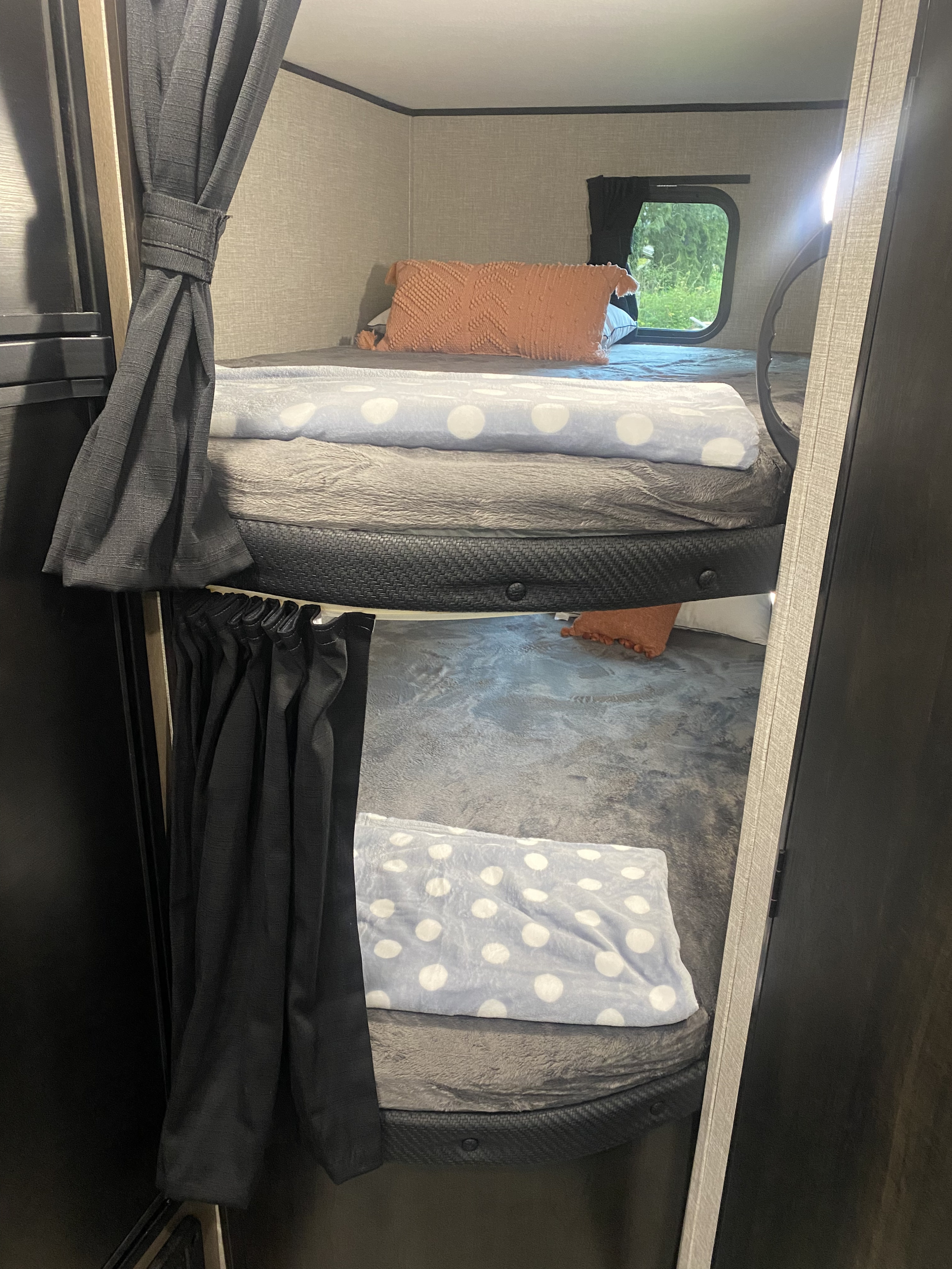 Explore this RV rental's cozy bunk beds. Upper and lower berths with privacy curtains & blankets. Ideal for your next trip.. Jayco Jay Flight SLX 8 2022