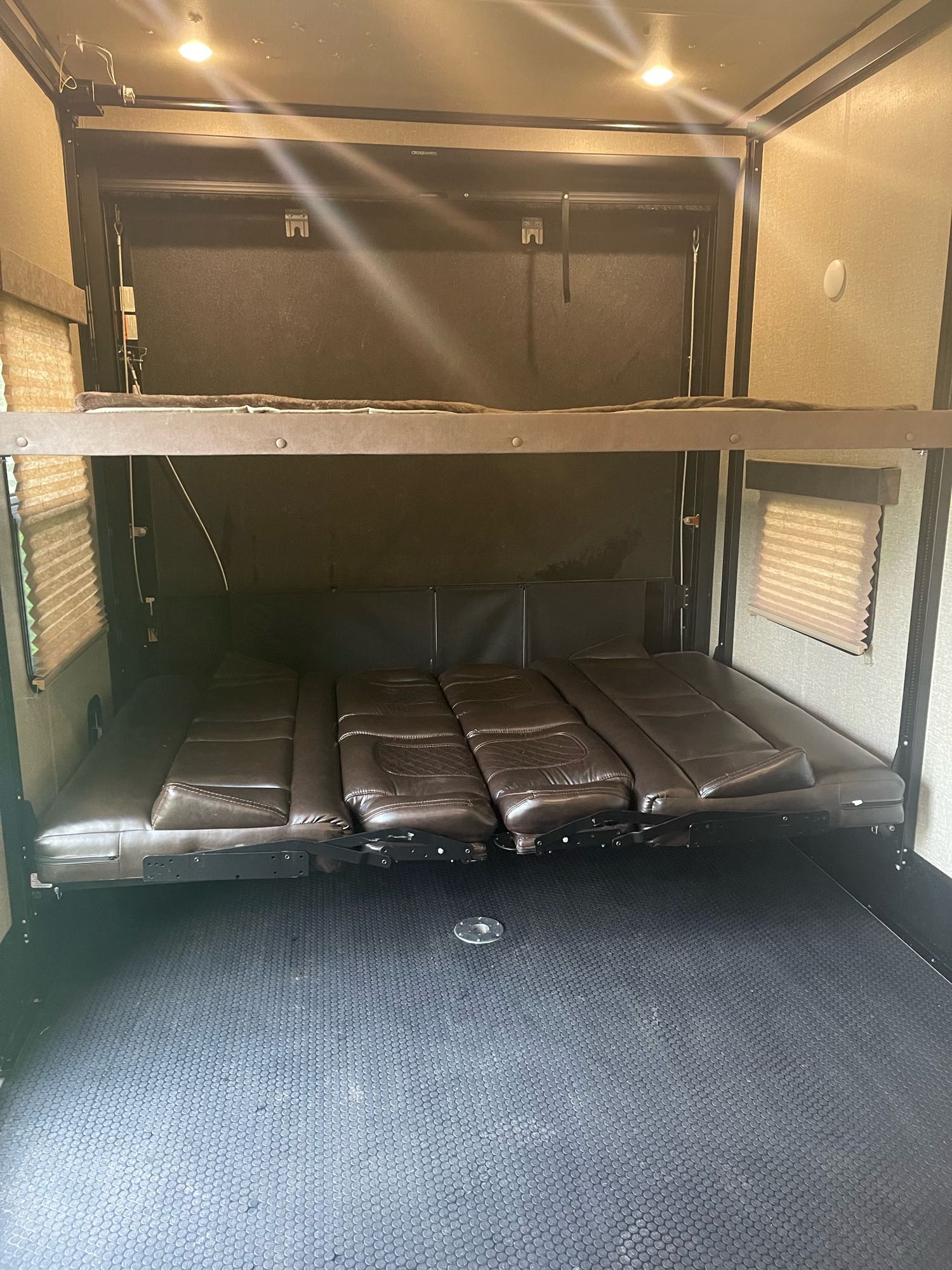 RV rental: Inside a versatile toy hauler with adjustable bunk beds and fold-down sofas over a durable floor.. Grand Design Momentum Toy Hauler 2019