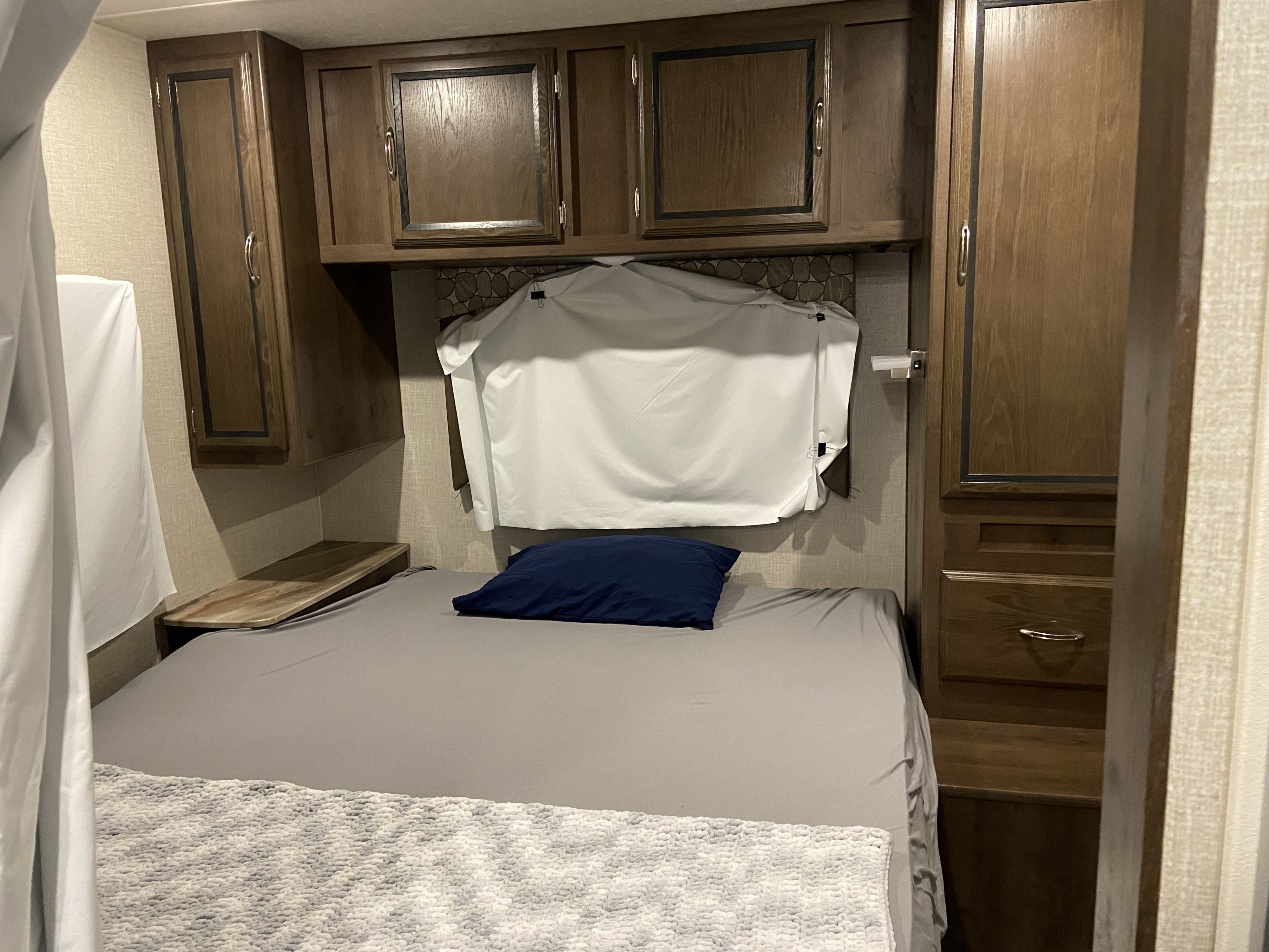 Master bedroom. As you can see, we have blackout fabric simply clipped to cover windows. This is very helpful for little nappers and long summer days.. Coachmen Freelander 2020