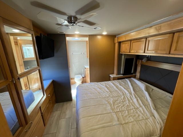 Master bedroom - Queen bed, tv, closet and master bath. Tiffin ALLEGRO 2022