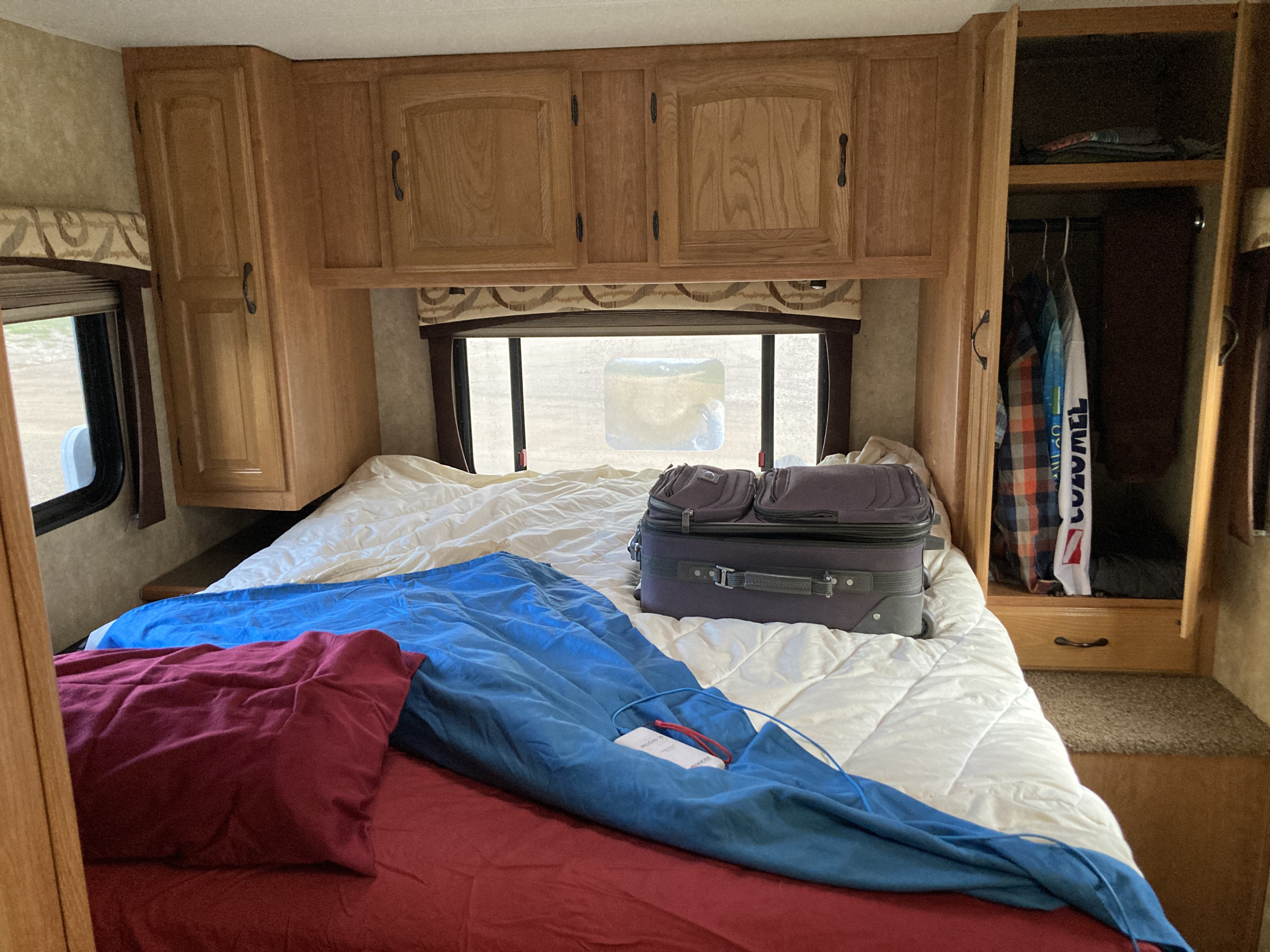 3 big windows, and a skylight make the bedroom feel spacious. There is a TV in the bedroom, but we have never used it. . Coachmen Freedom Express 2009
