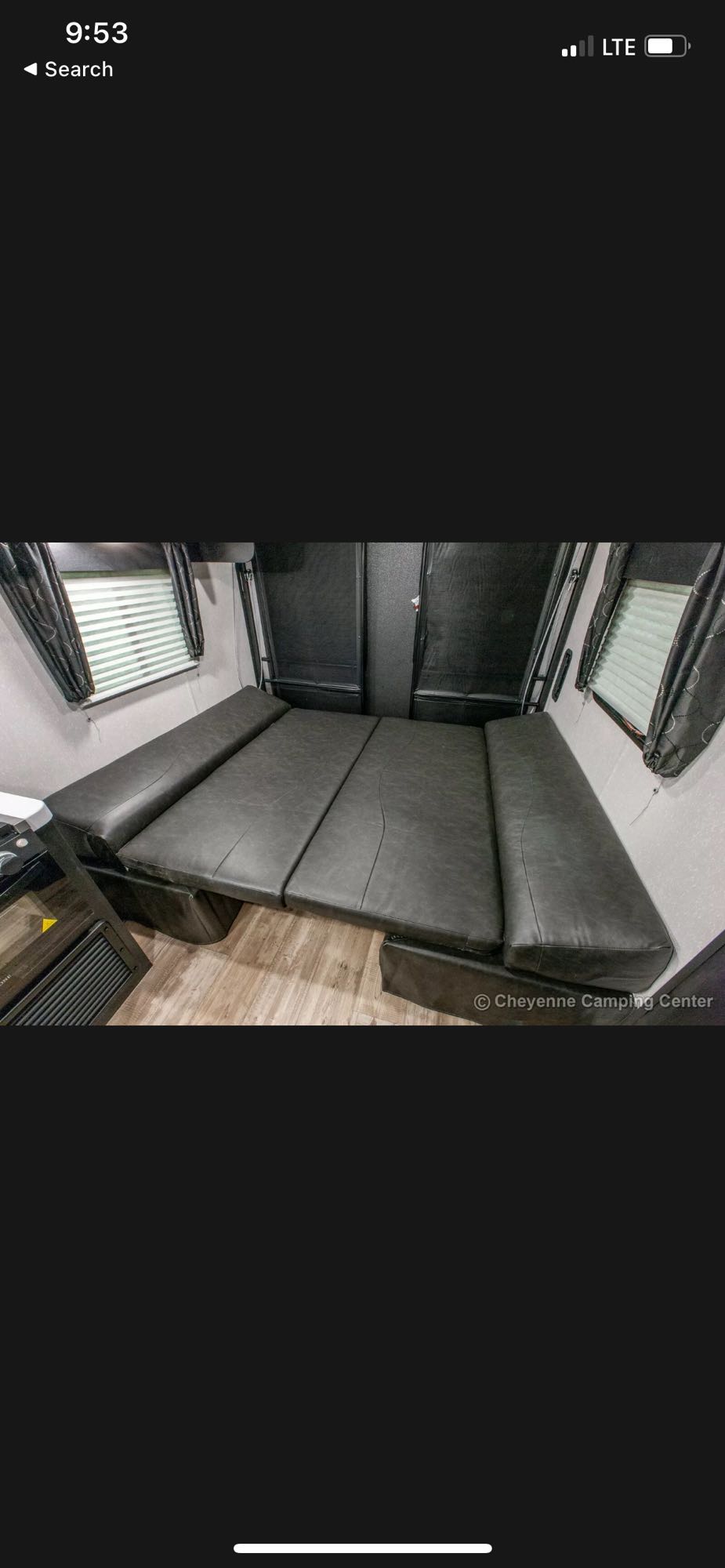 RV rental: Gray cushioned benches convertible to a bed in a camper interior. Windows visible.. Forest River Cherokee Grey Wolf 2022