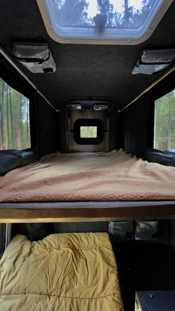 The upstairs sleeping area measures 48 inches by 80 inches with windows on all sides and a roof hatch. Lay down and stare up at the stars ✨ . Jeep Gladiator 2022