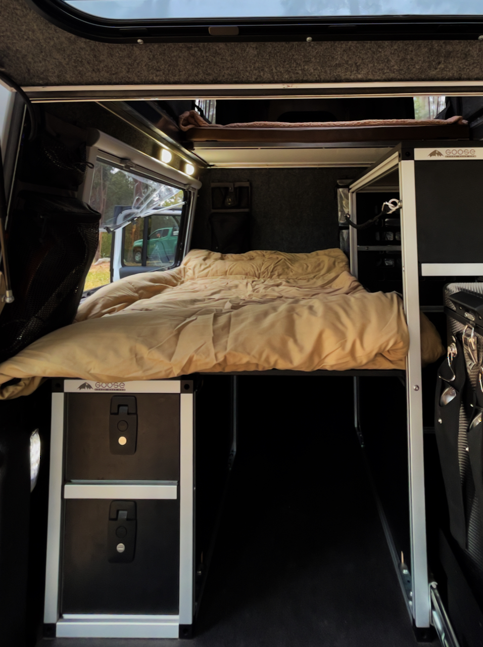 The downstairs sleeping area with storage underneath. . Jeep Gladiator 2022