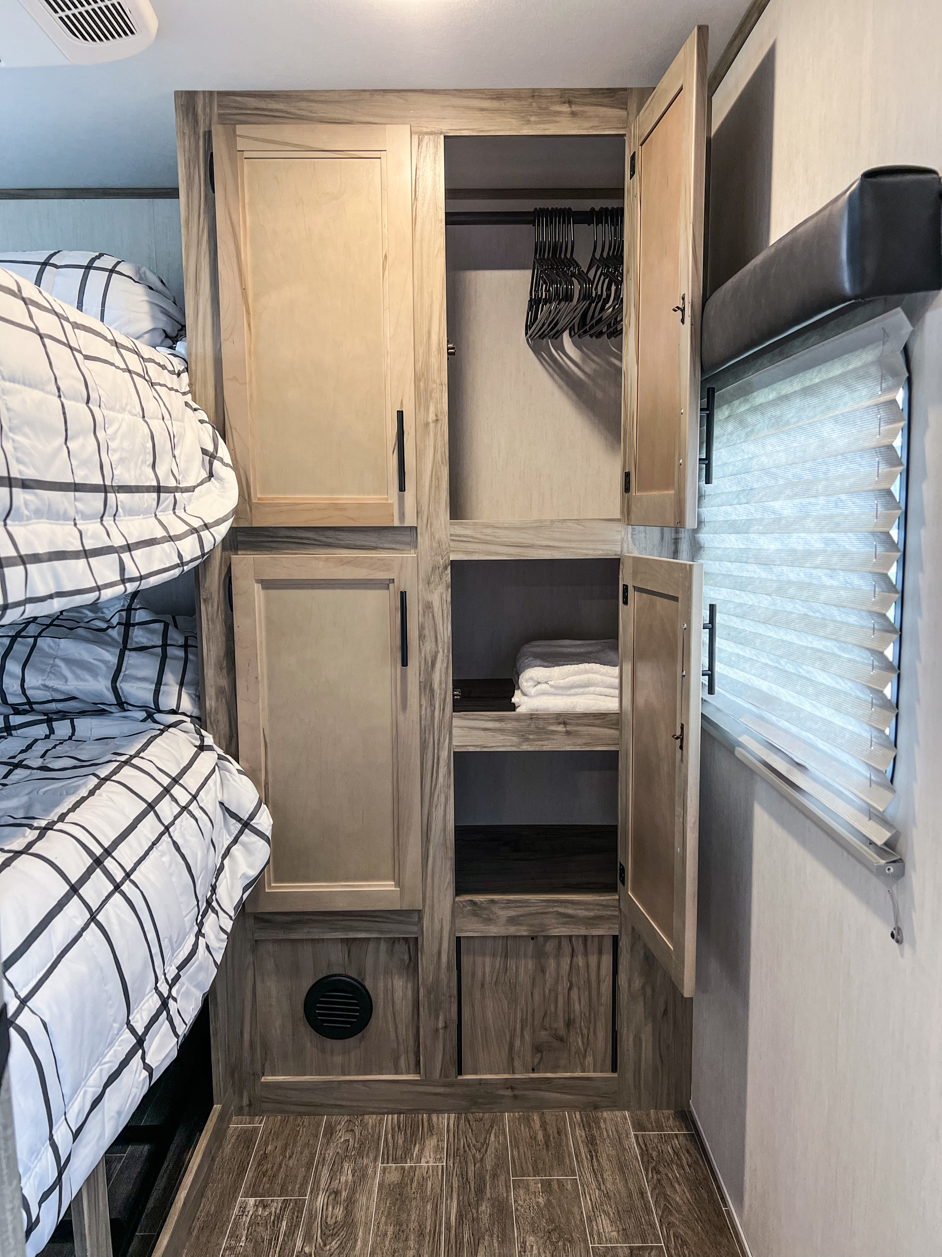 Bunkroom Wardrobe
Features:
-Floor to ceiling storage
-Hanging clothes space and hangers
-Two shelving levels. Forest River Cherokee Alpha Wolf 2022