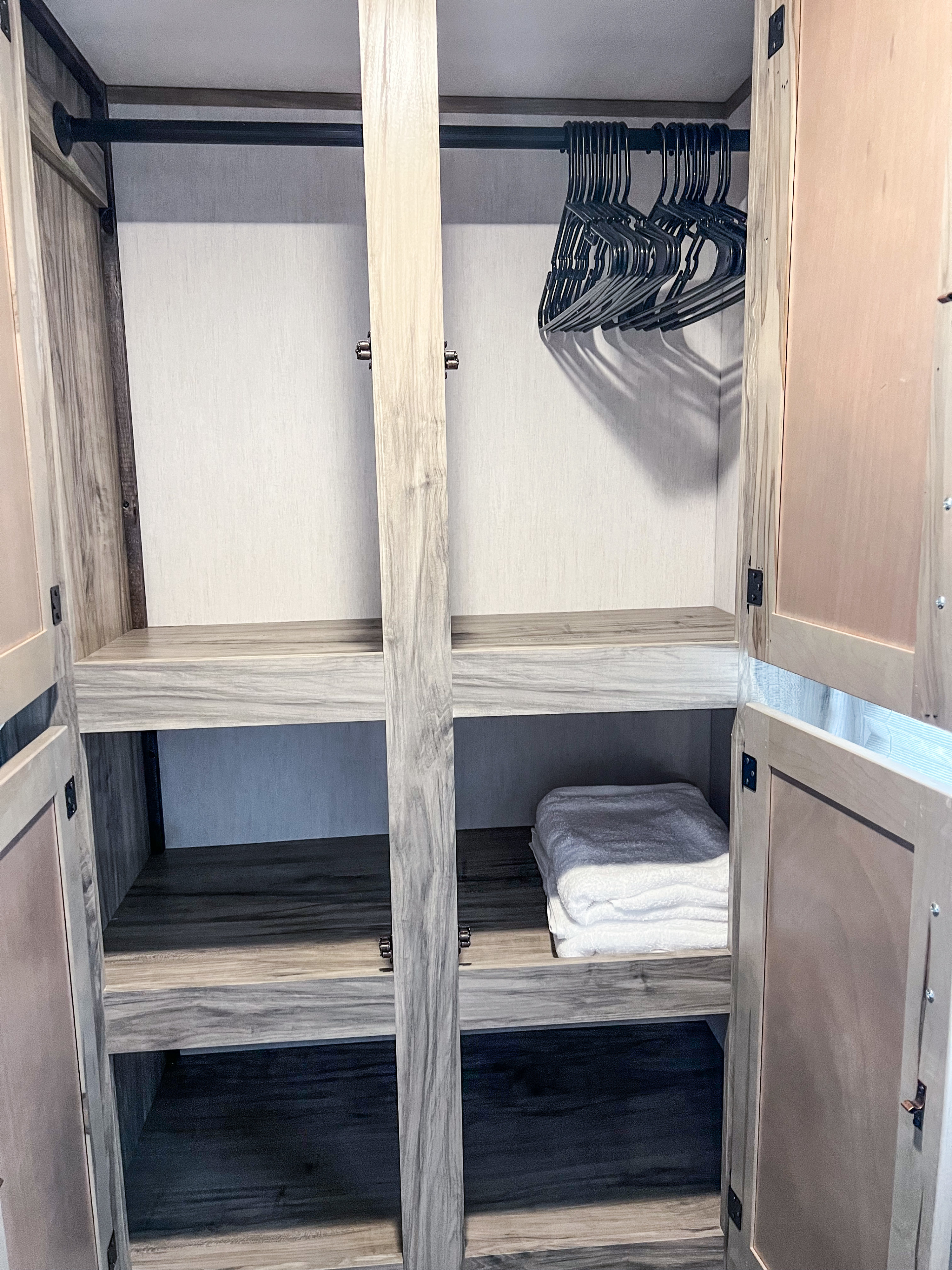 Bunkroom Wardrobe
Features:
-Floor to ceiling storage
-Hanging clothes space and hangers
-Two shelving levels. Forest River Cherokee Alpha Wolf 2022