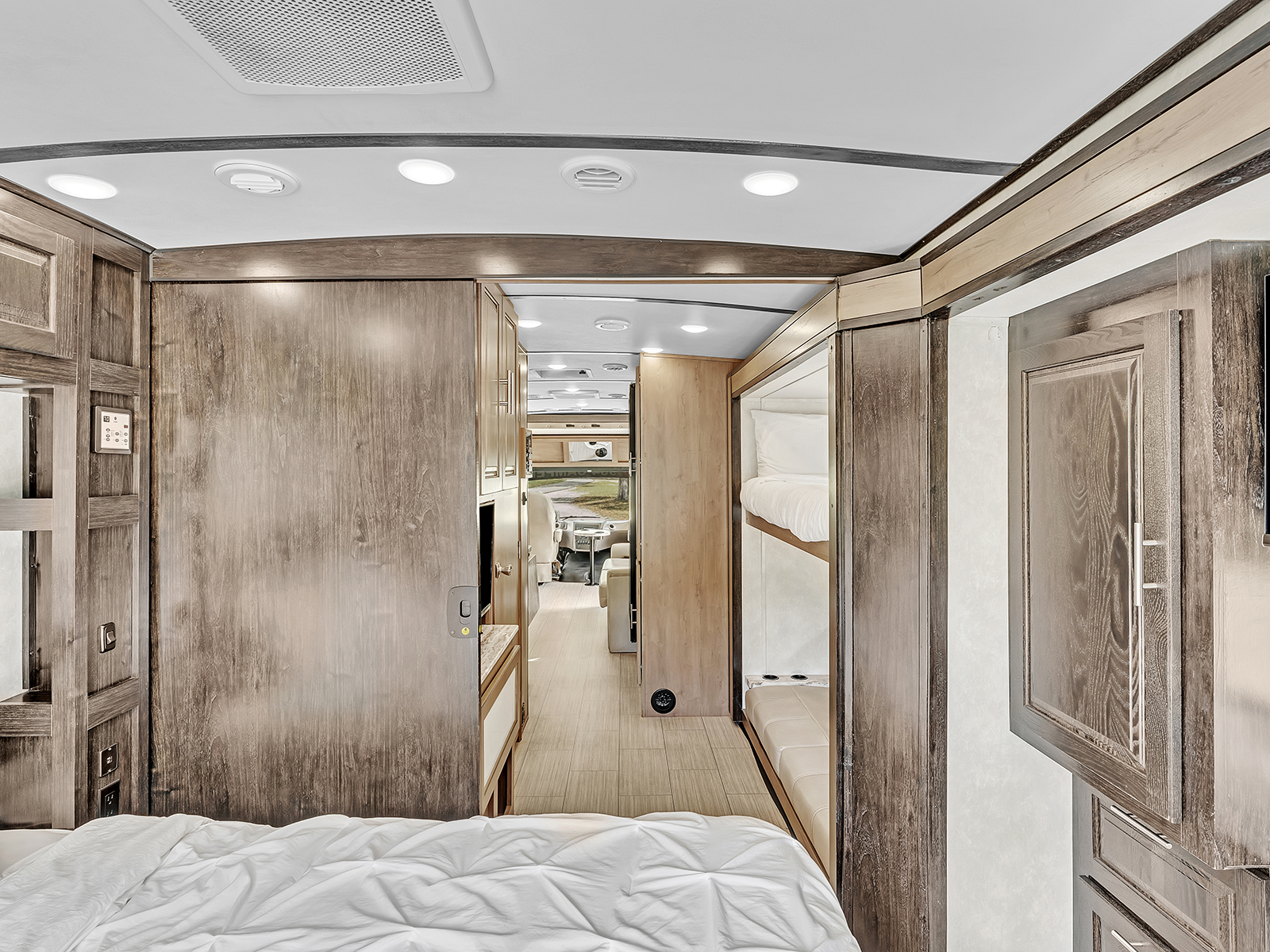 Bright, modern RV rental interior featuring bunk beds and ample living space.. Forest River FR3 2021