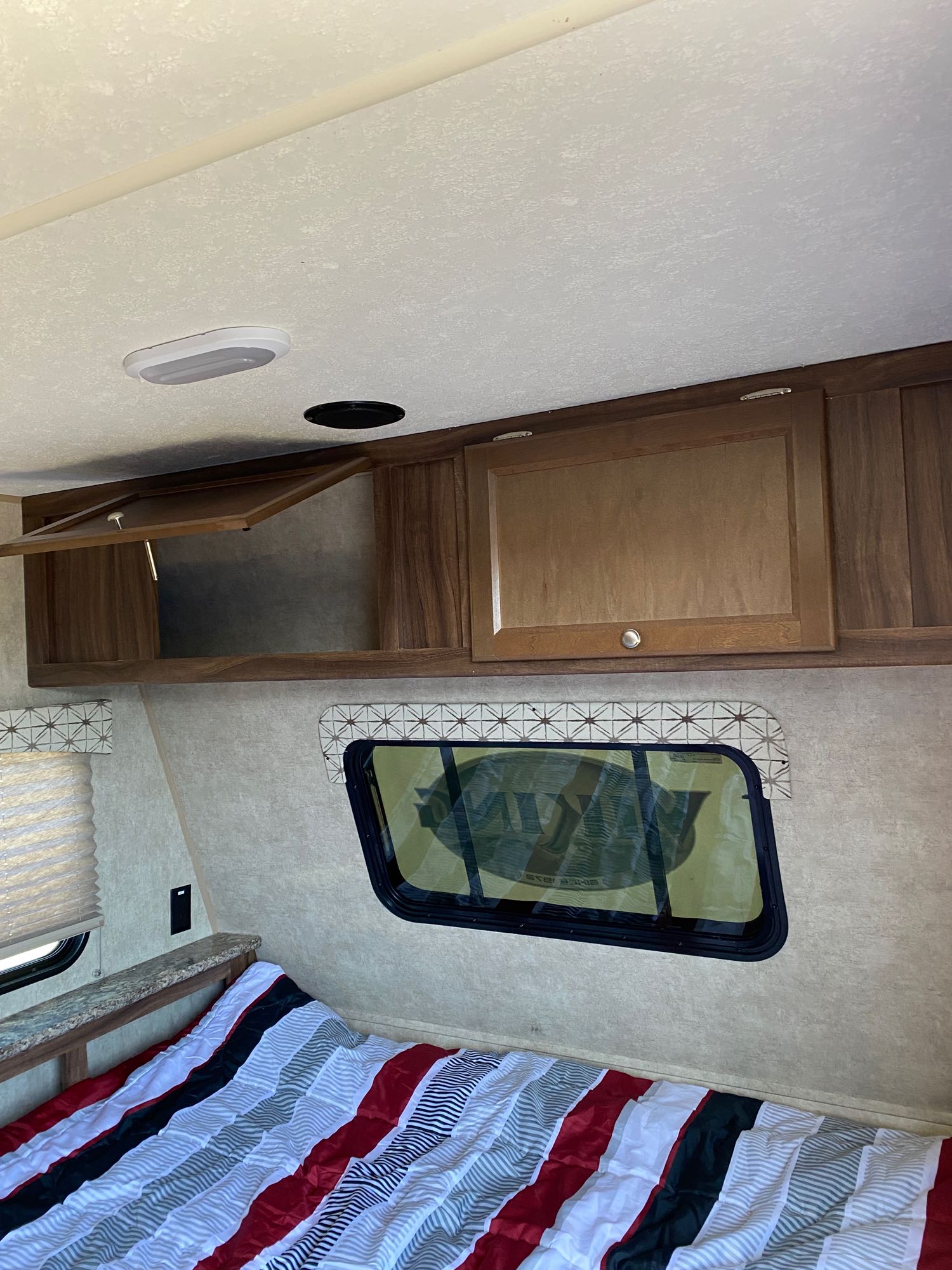 Over the bed is cabinet storage for all your belongings and extra bedding.. Coachmen Viking 2017