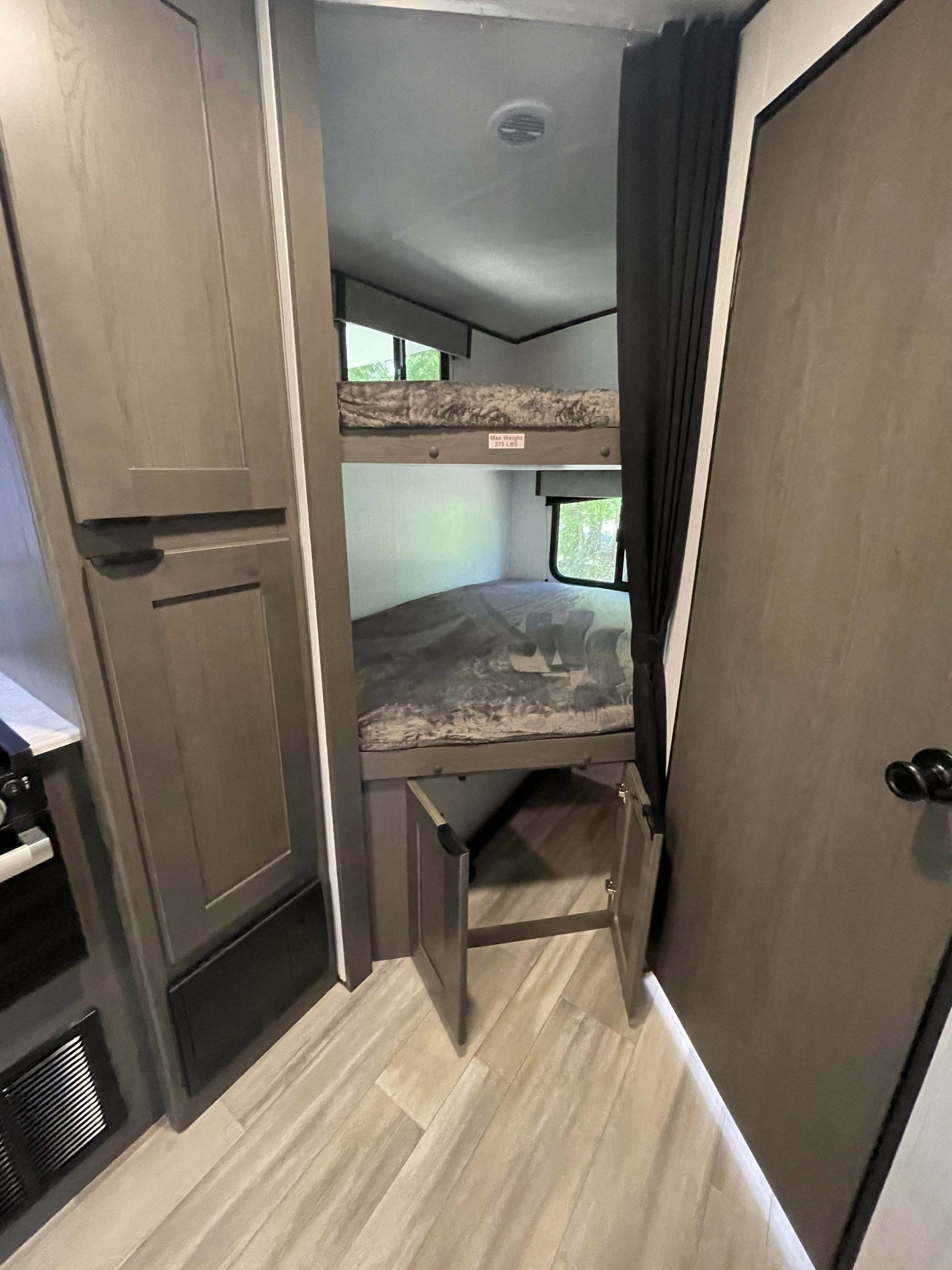 RV rental bunk beds: a cozy sleeping area with built-in storage and windows, max weight 275 lbs.. Heartland Mpg 2022