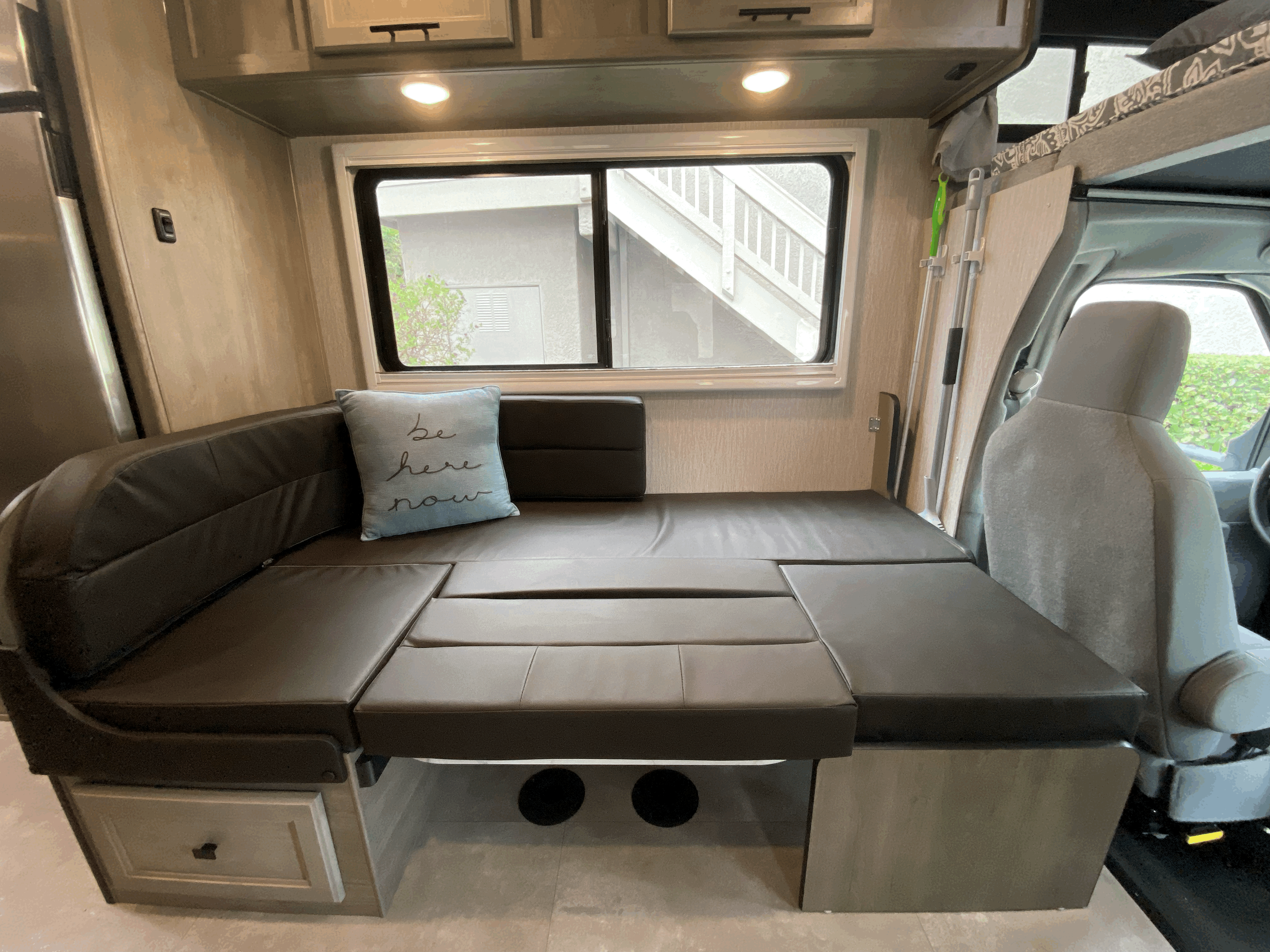This versatile RV rental features a dark brown dinette that converts into a bed, with a window and storage.. Forest River Coachmen Cross Trail XL 2022