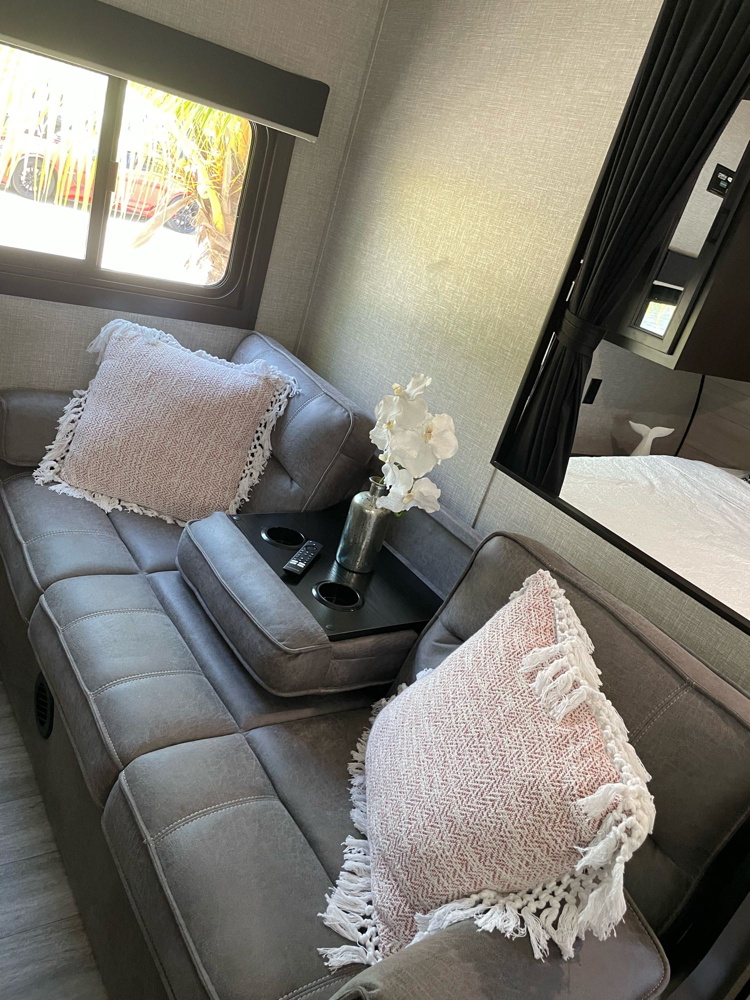 Inviting RV rental interior: comfortable sofa, modern decor, and view into the bedroom area.. Jayco JAYCO JAY FLIGHT SLX 264BH 2022