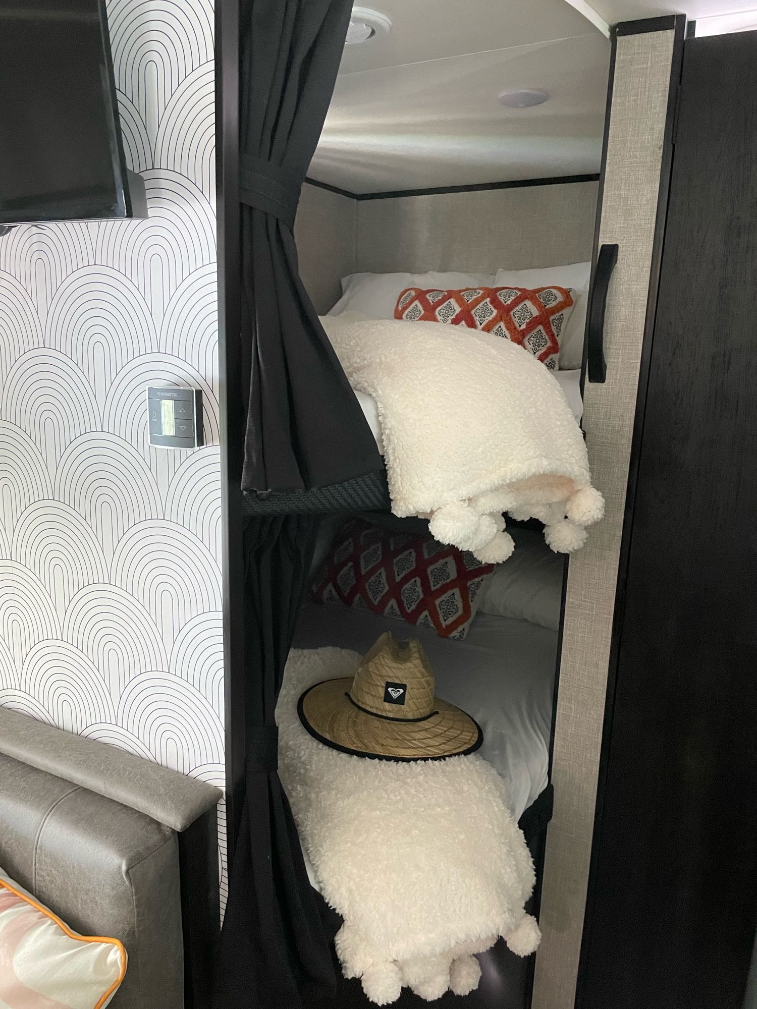 Cozy rv rental bunk beds with comfy blankets, stylish decor & arched wallpaper. Perfect camper interior!. Jayco JAYCO JAY FLIGHT SLX 264BH 2022