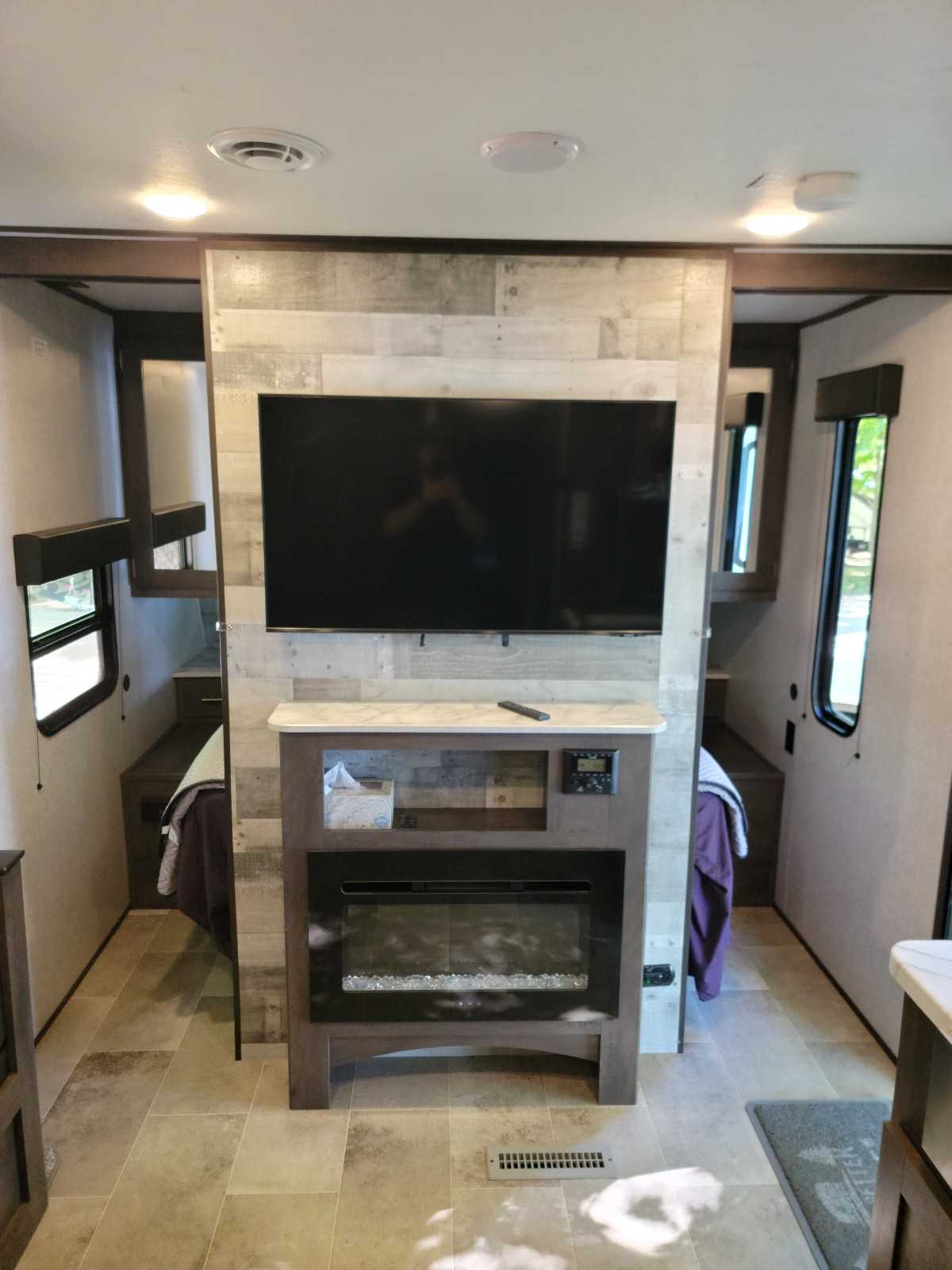 Front of RV with bedroom doors open. Electric fireplace puts out a surprising amount of heat enabling you to save your propane.. Coleman Lantern 300TQ 2021