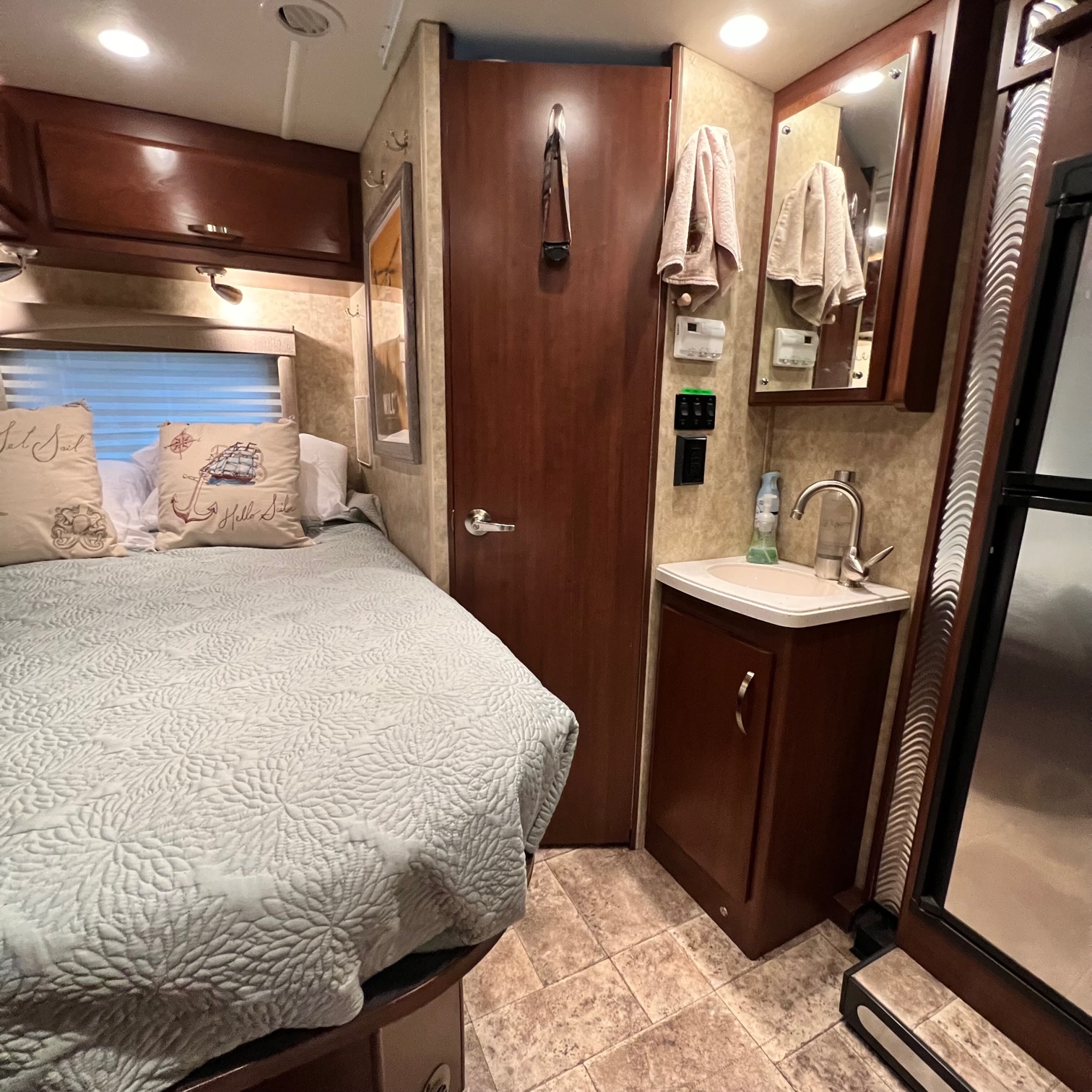 Full-size bed next to the bath.. Tioga Ranger DSL 2013