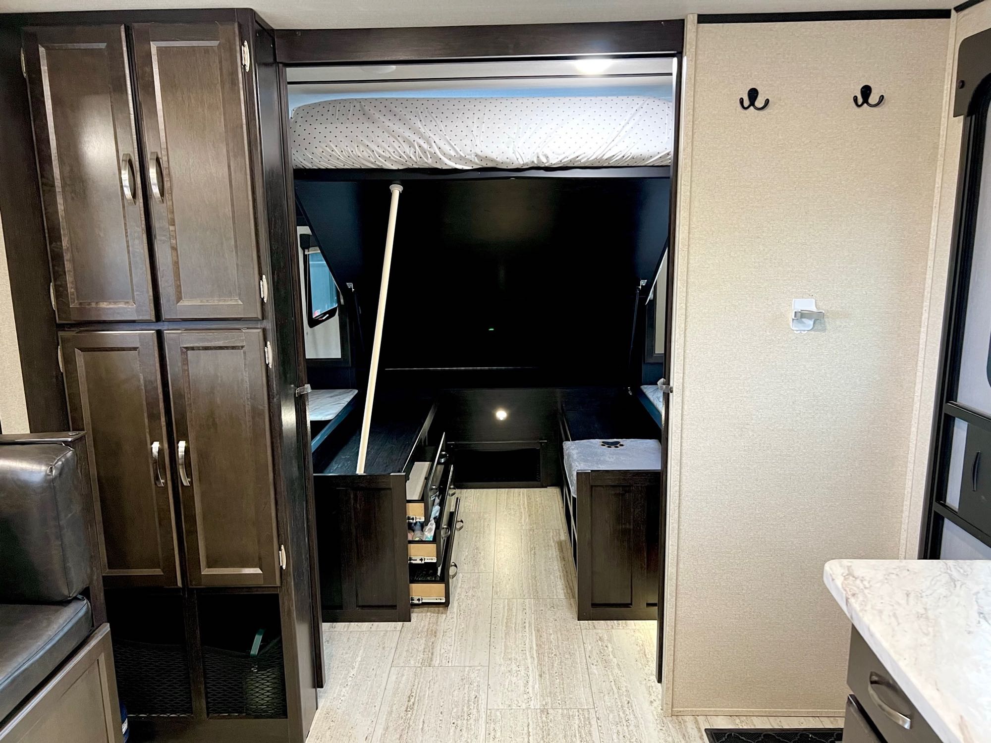 Bed lifts up to access storage and drawers underneath bed. Coachmen Spirit XTR 2549BHX 2020