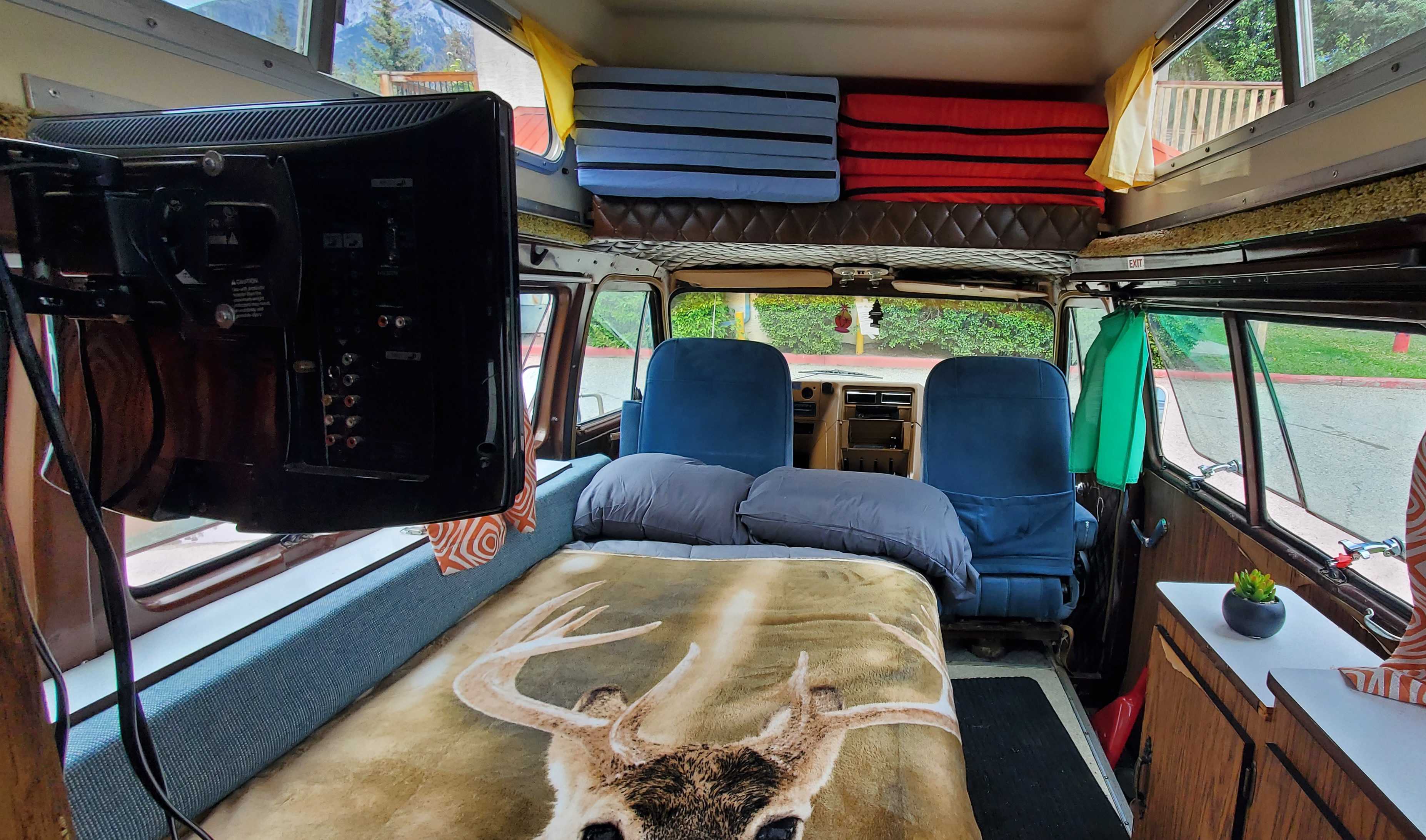 The bed is between a twin and a full, but fits two adults just fine. I'm 6'4 and it's great. There's a fitted and flat sheet, comforter and two blanke. Gmc Motorhome 1979