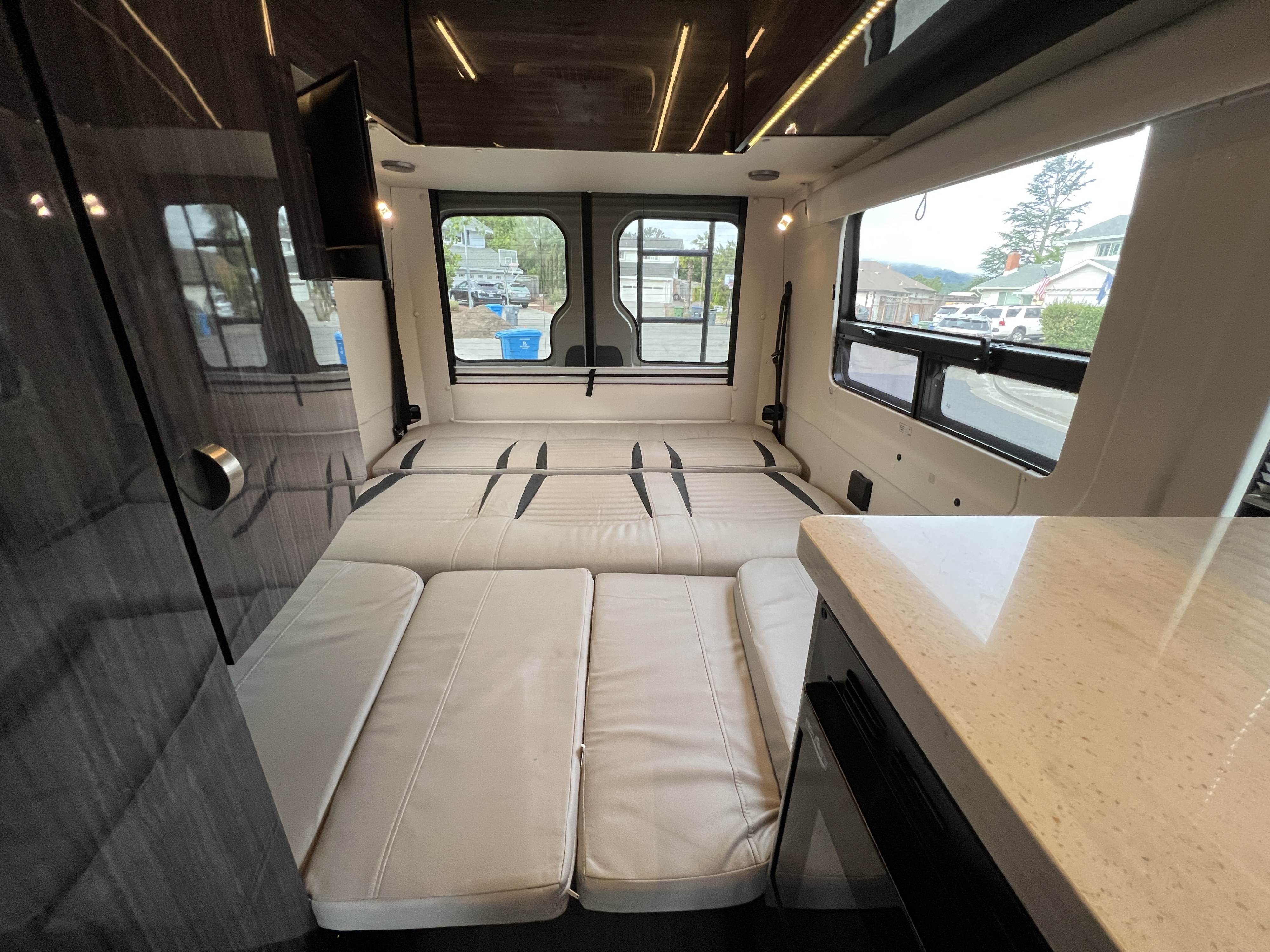 Catch z's in style with the fold down queen size sofa bed, ambient lighting and vented windows with sun blocking pull down shades.. Winnebago Era 2019