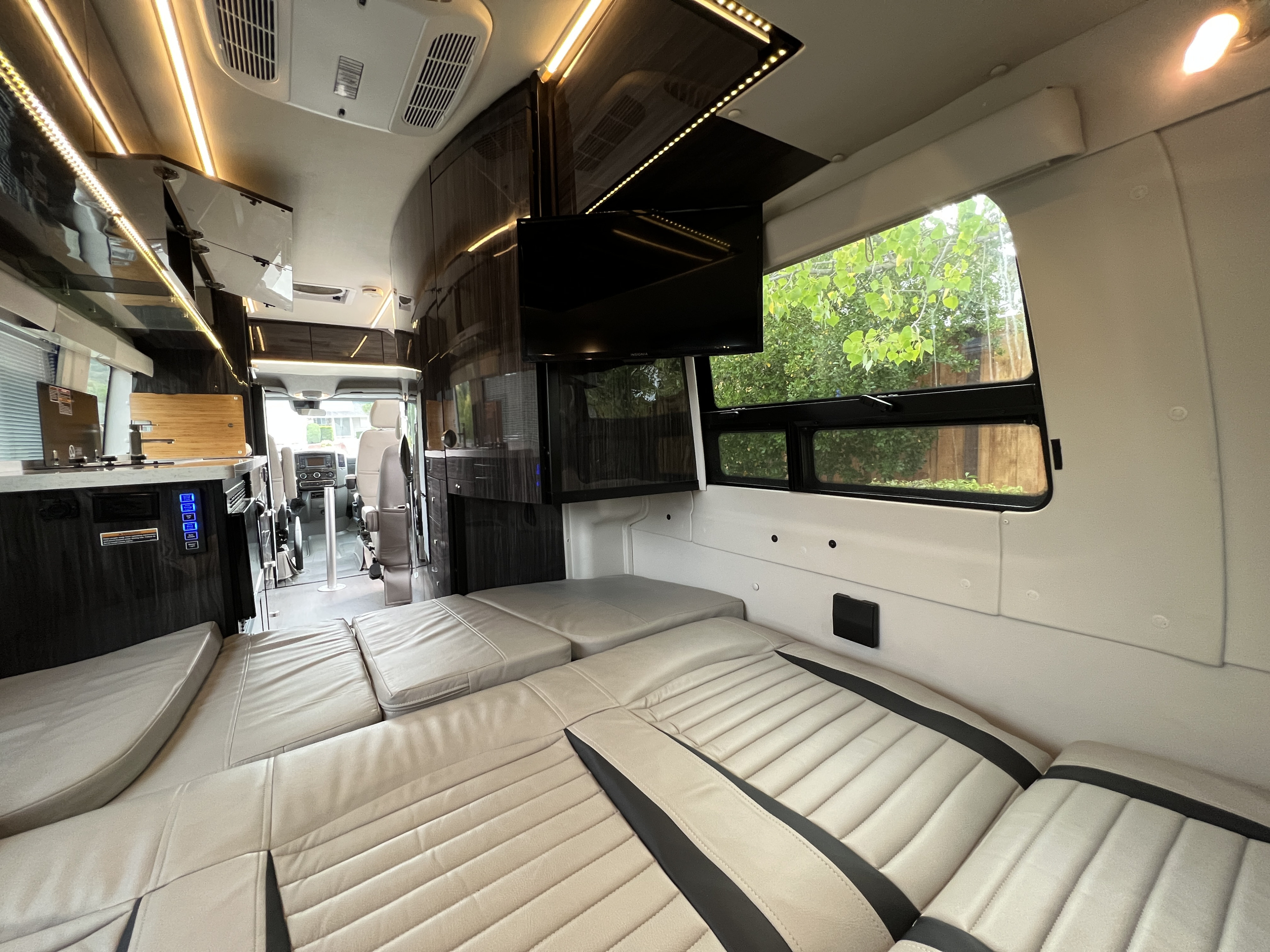 Relax in the queen size fold down bed with climate control, ambient lighting, TV, DVD and Bluetooth audio.. Winnebago Era 2019