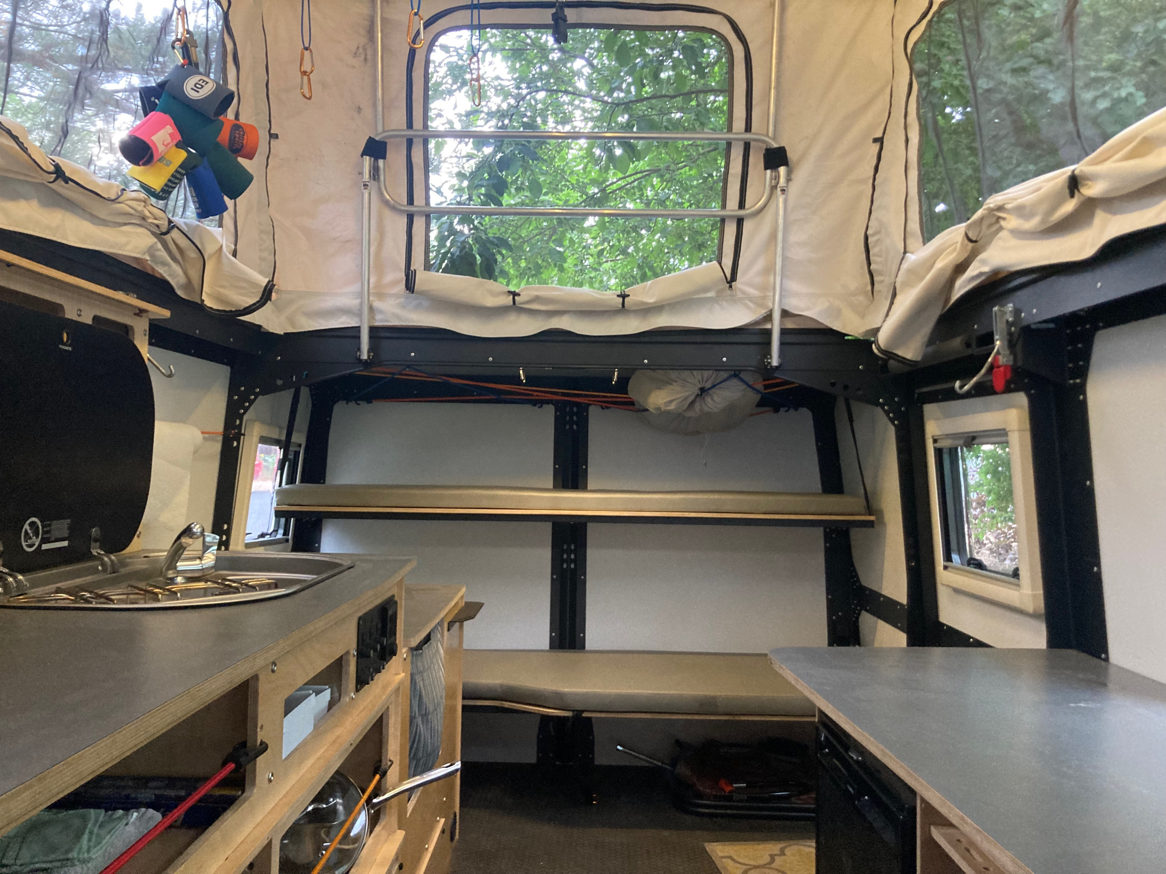 Bunk beds, bench seat or storage for 2 bikes (mountain bikes included!). An adult can fit, but we think these bunks are better for kids. . TAXA TAXA Trailer 2019