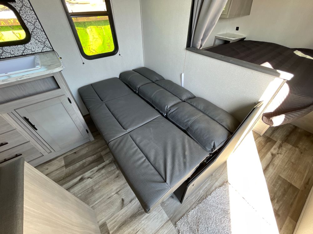 Sofa down as a bed. Coleman Lantern 2022