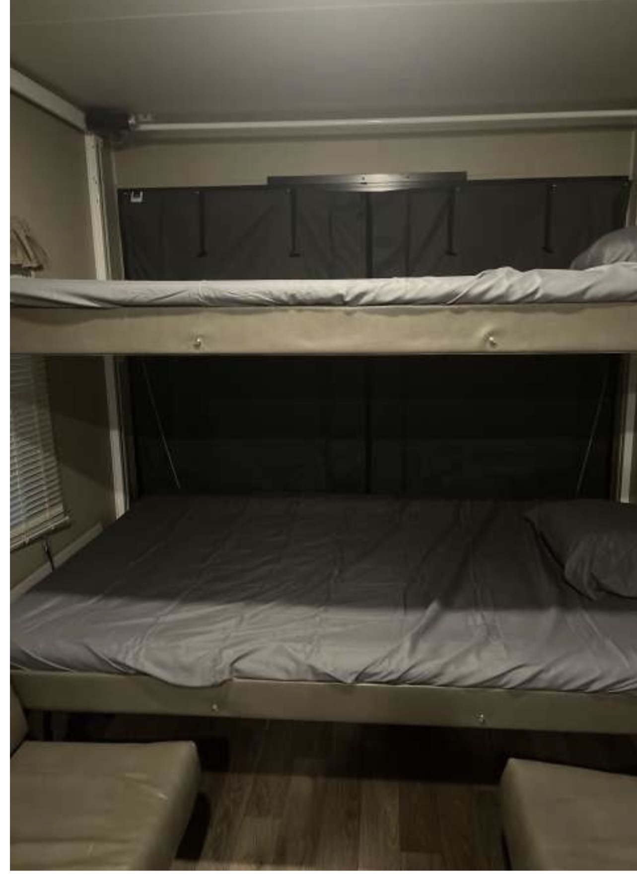 Bed’s on electric rail that go to ceiling for garage space. Forest River Puma 2016