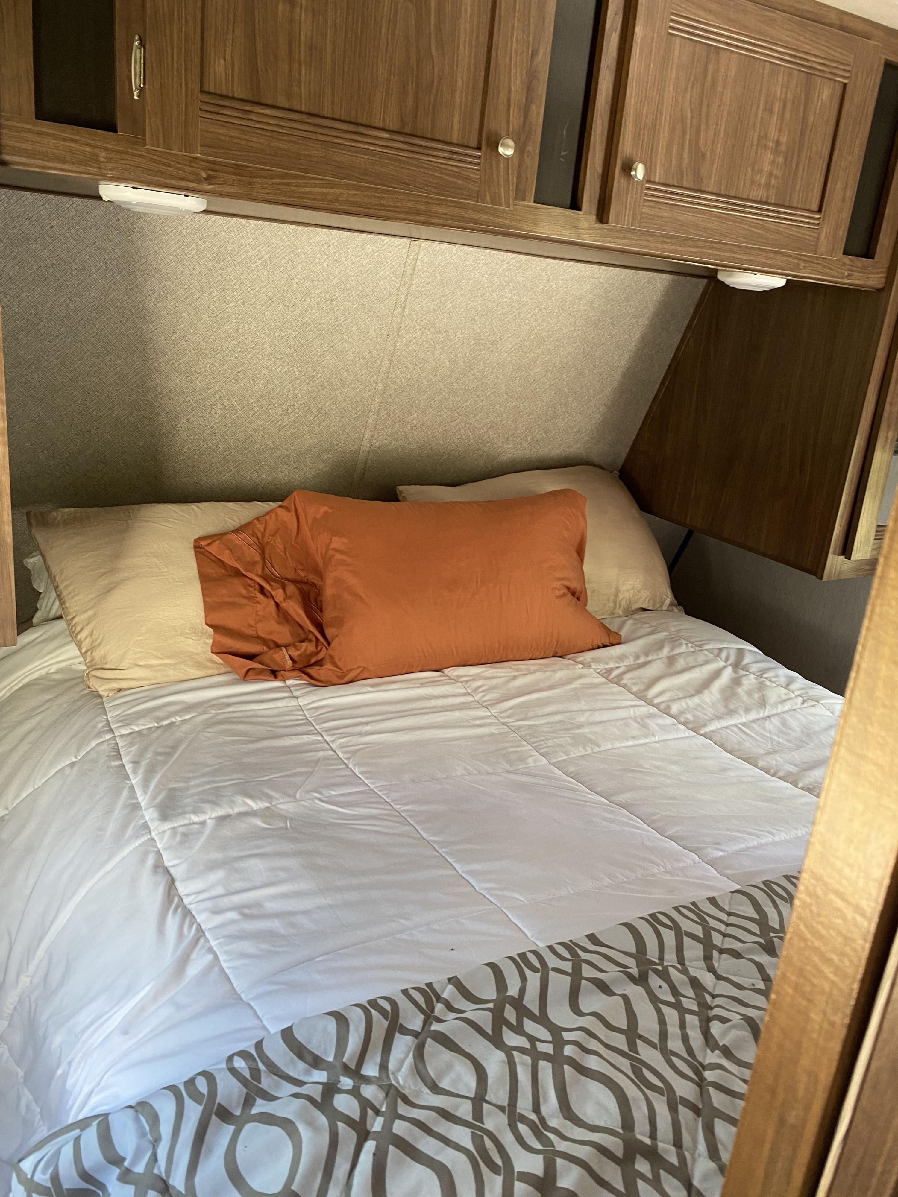 Front room, bed lifts for additional storage. Each guest has their own pocket door for privacy.. Heartland RVs Trail Runner 2019