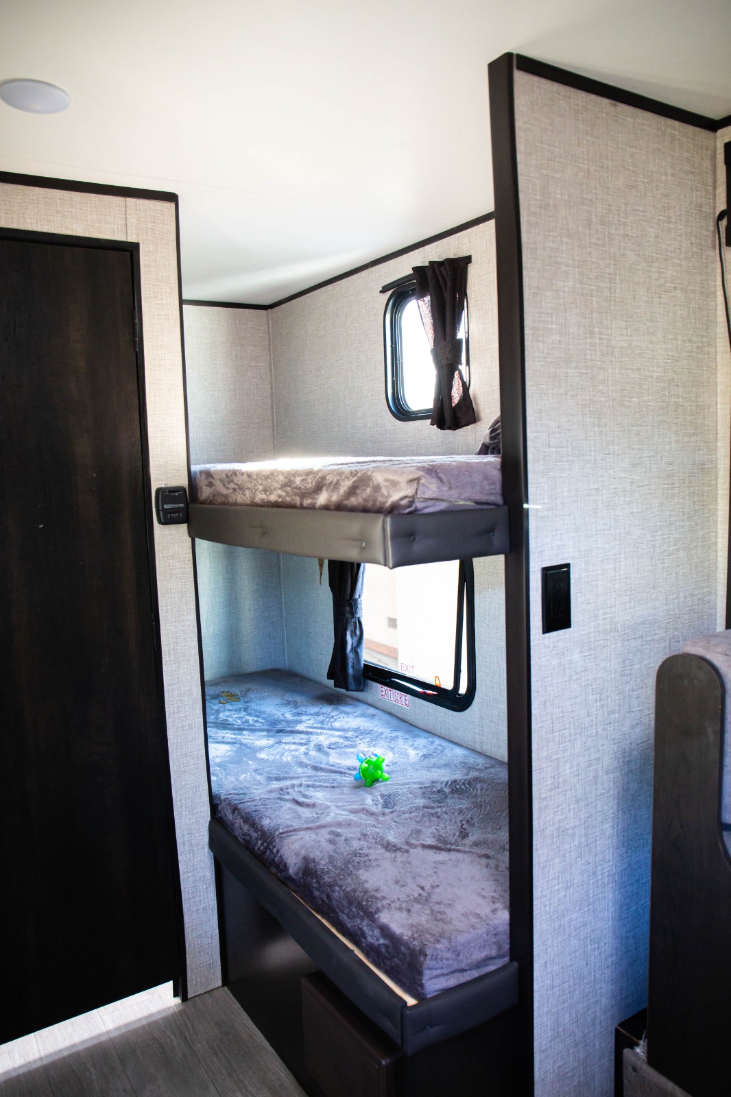 Cozy RV rental interior showing two bunk beds with windows, perfect for extra guests.. Jayco Jay flight slx 7 2022