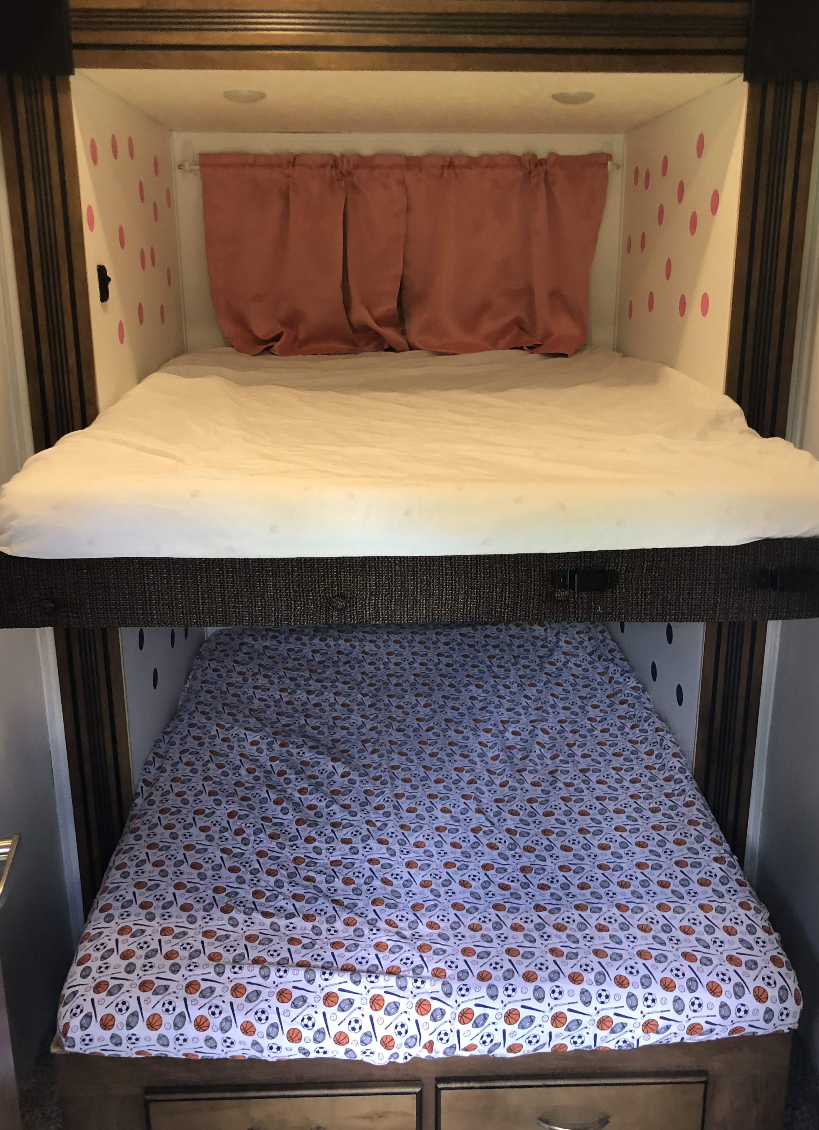 RV rental: Compact bunk beds. Top bed with pink polka dots & curtain, bottom with sports sheet. Ideal for kids!. Forest River Coachmen Chaparral 2018