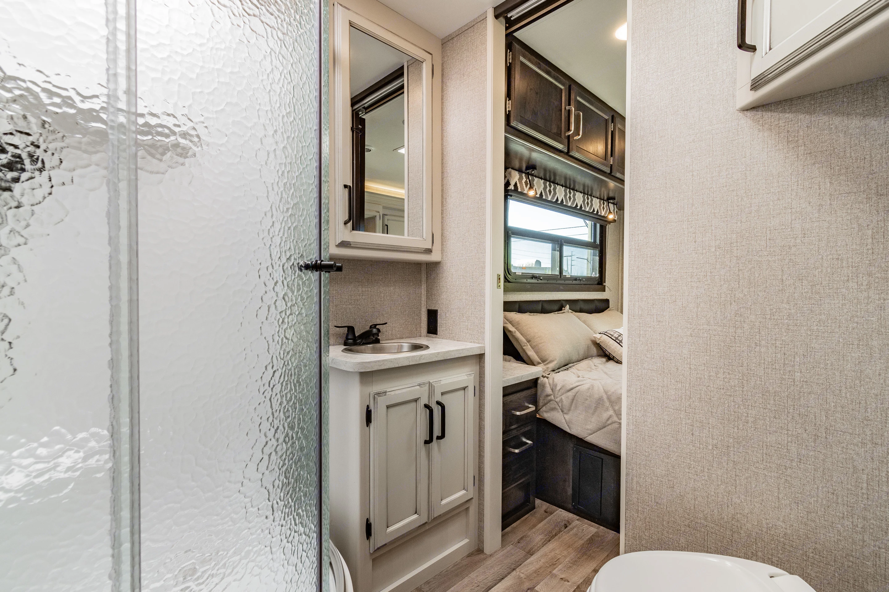 Big bathroom area with sliding glass shower doors. . Jayco Redhawk 2021