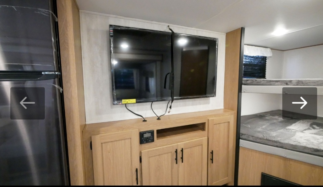 Inside this RV rental: flat-screen TV, entertainment center, refrigerator, and comfortable bunk beds for your travels.. Avenger Avenger Trailer 2022