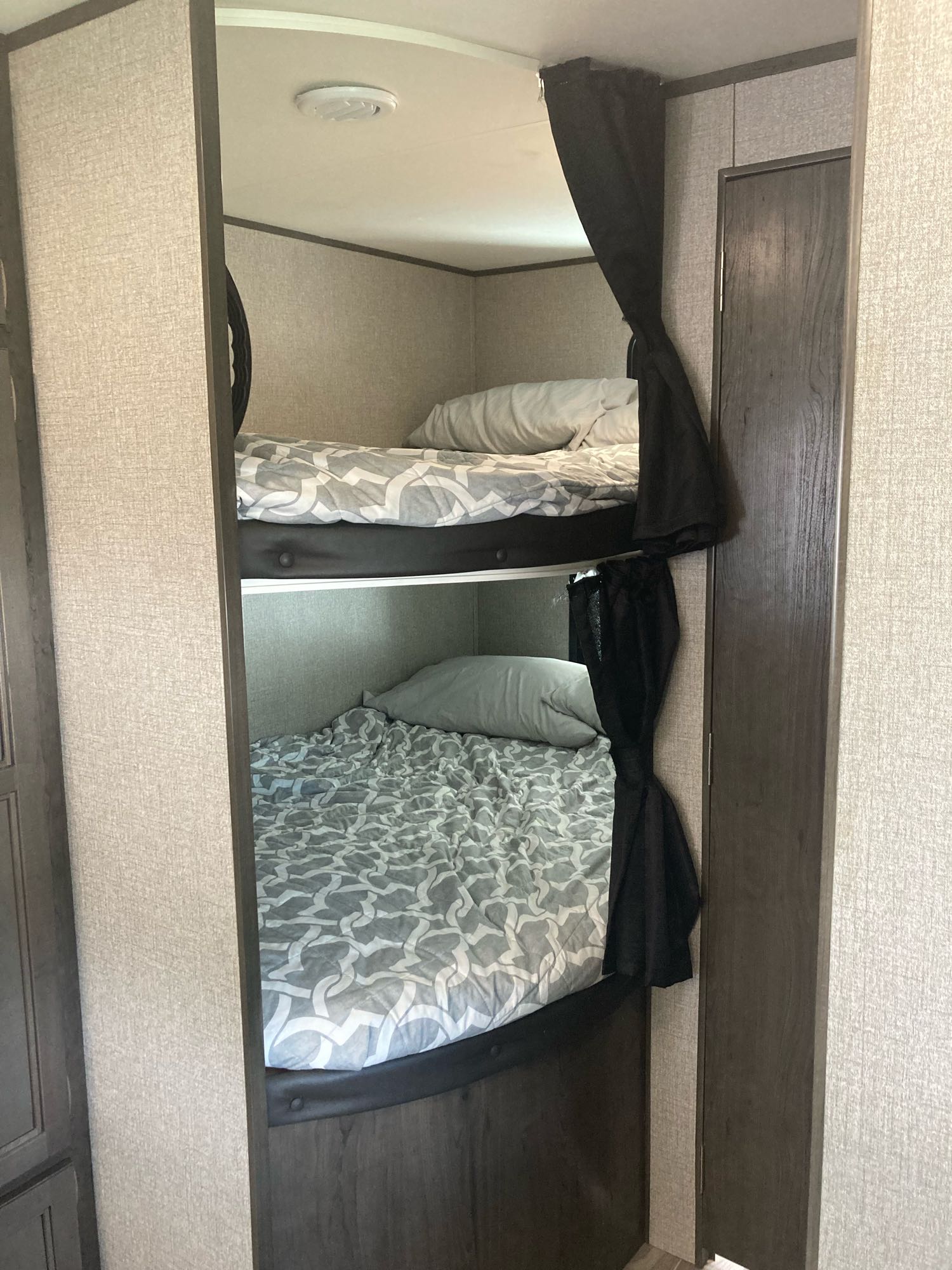 Cozy bunk beds in an RV rental, perfect for family travel or camping adventures.. Jayco Jay Flight 2021