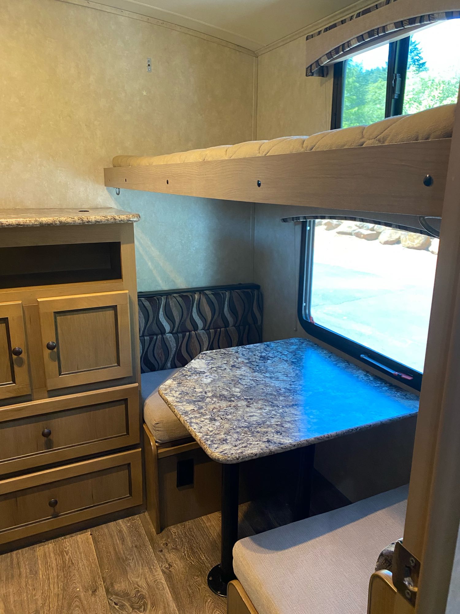 Cozy RV rental interior featuring bunk beds, a dinette, and storage. Perfect for family adventures on the road.. Cruiser Rv Corp 280Bunkhouse Cruiser 2015